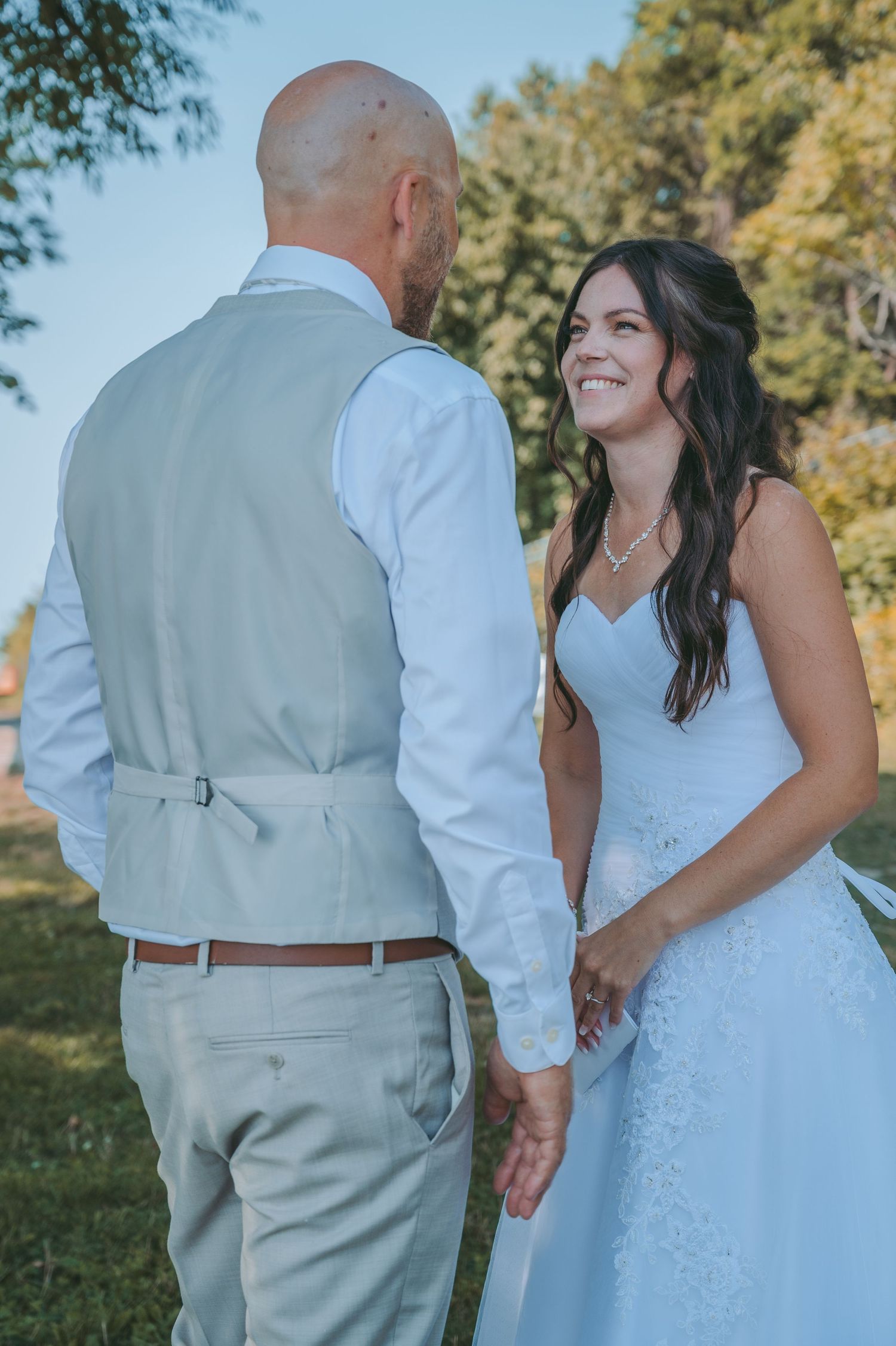 A couple shares an intimate moment outdoors during their wedding photoshoot.
