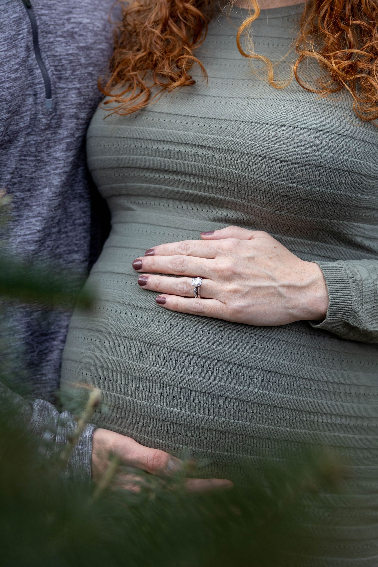 A close-up series showing a hand with painted nails and wedding ring resting on a sage green textured fabric.