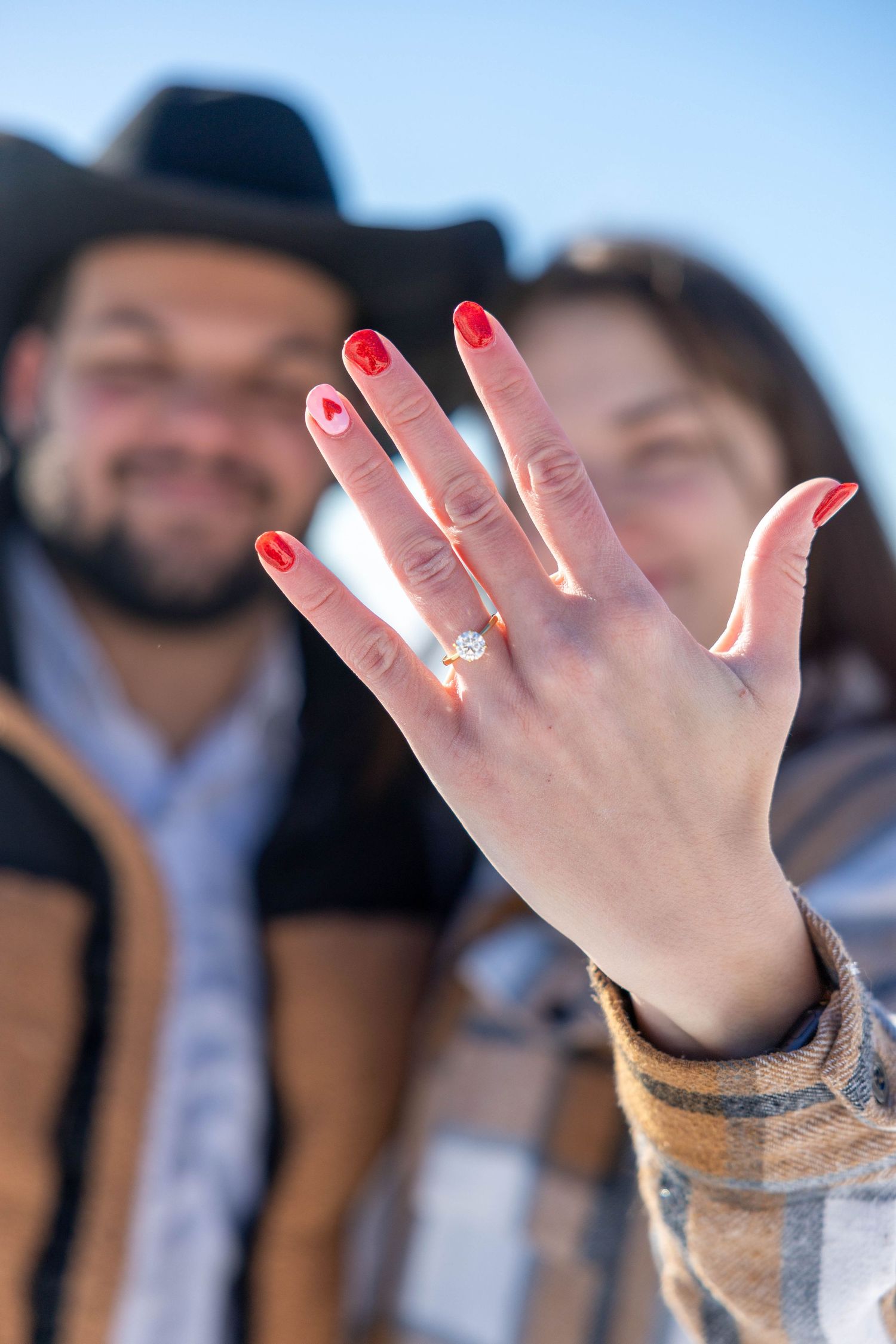 A series of hands showing off engagement rings in a progressive sequence of photos.