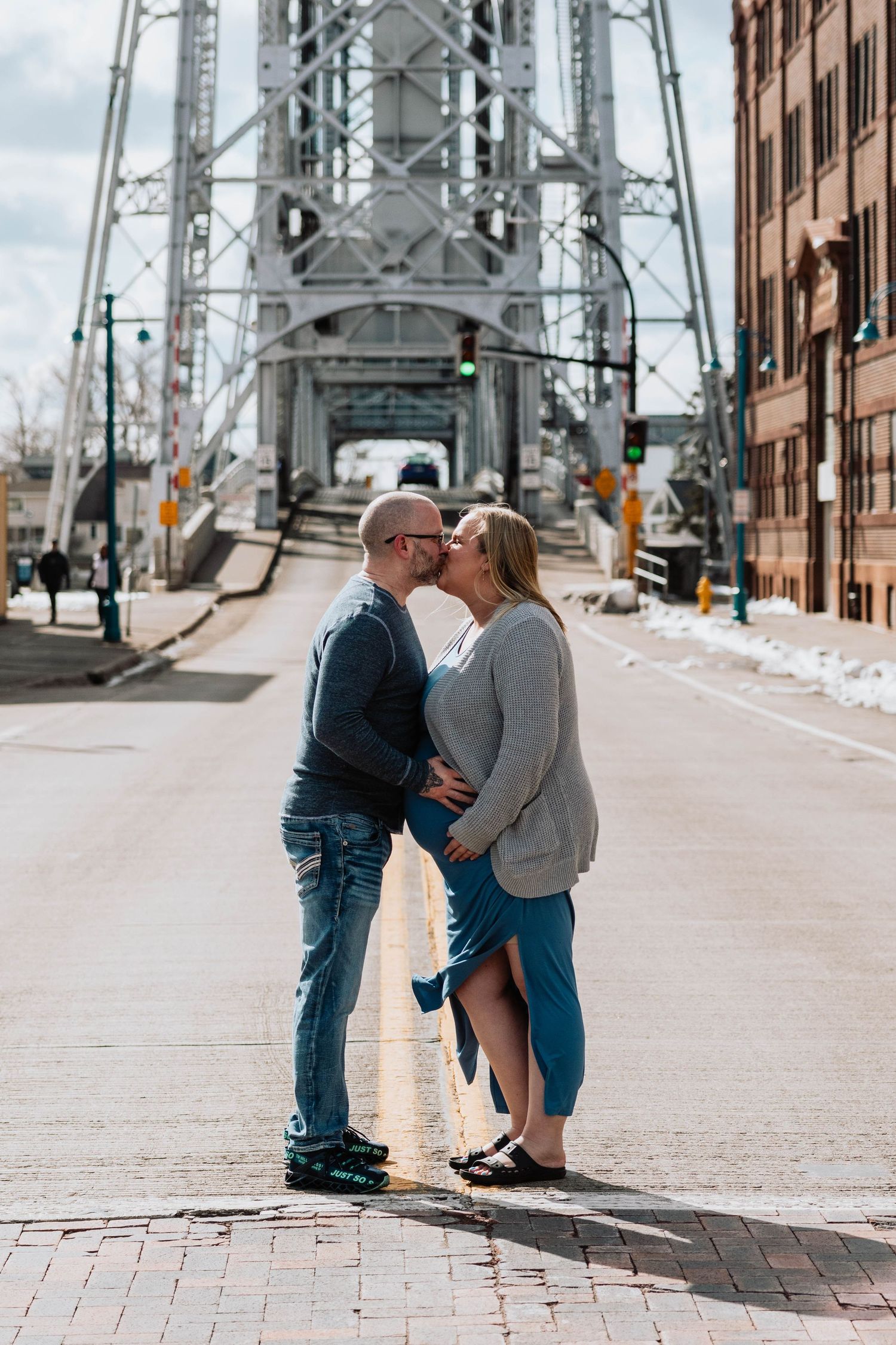 A romantic moment shared beneath a large steel bridge structure on a brick paved street.
Canal Park Duluth MN