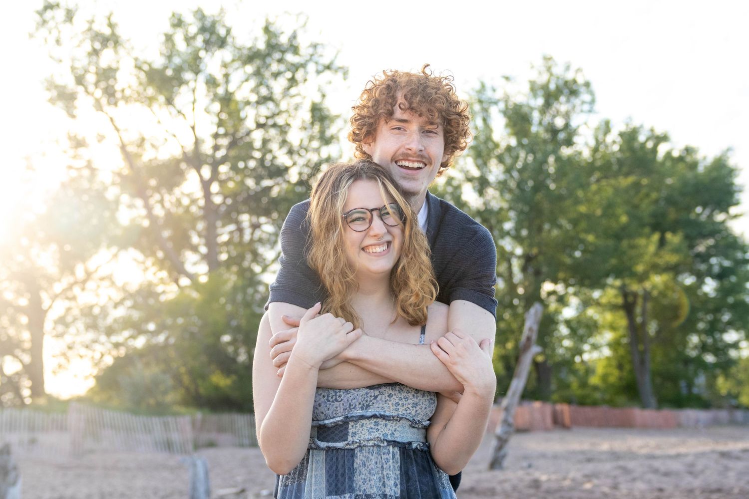 A series of candid outdoor engagement photos taken at sunset showing joyful moments between a couple.