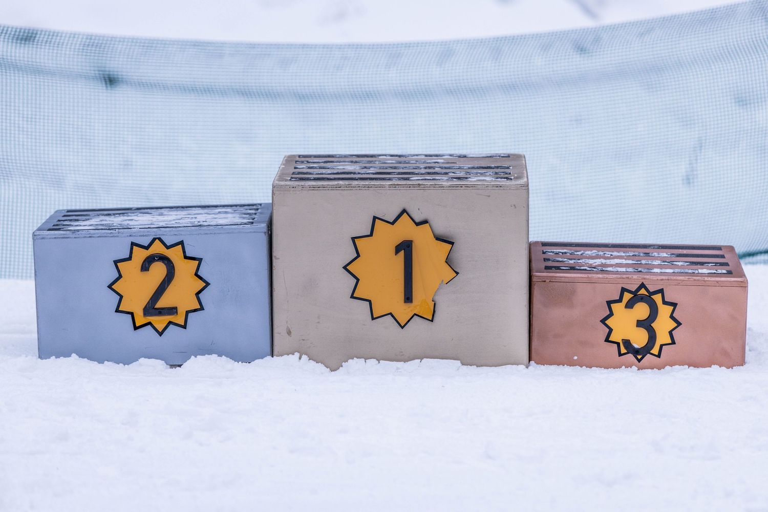 Numbered paper cards with yellow and blue colors arranged in sequence on a light surface.