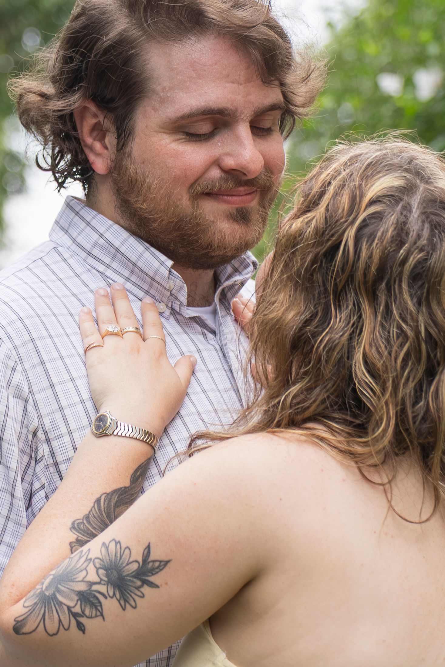 Candid moment of couple laughing together after proposal – NYC surprise engagement session by Laura Mahl