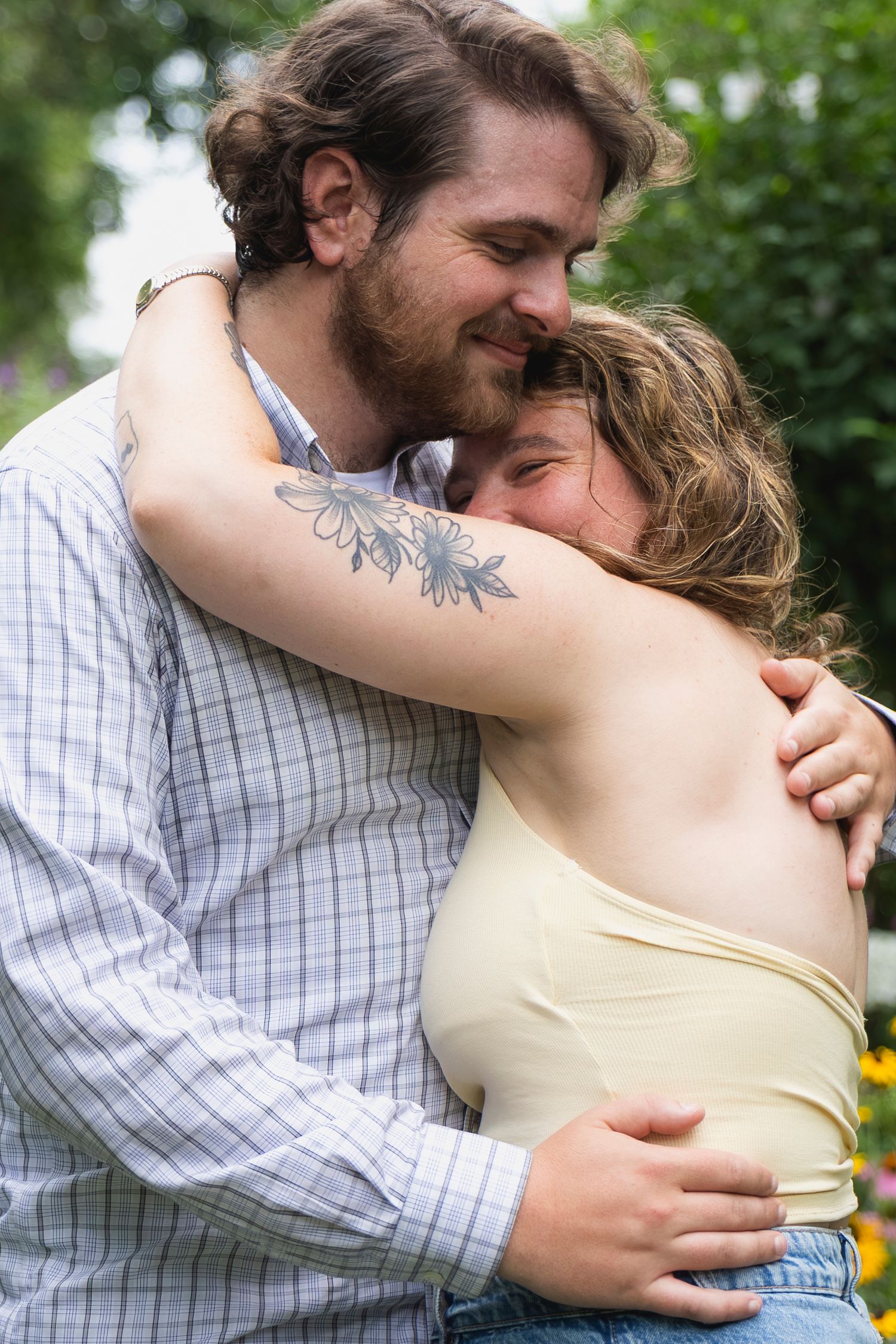 Candid moment of couple laughing together after proposal – NYC surprise engagement session by Laura Mahl