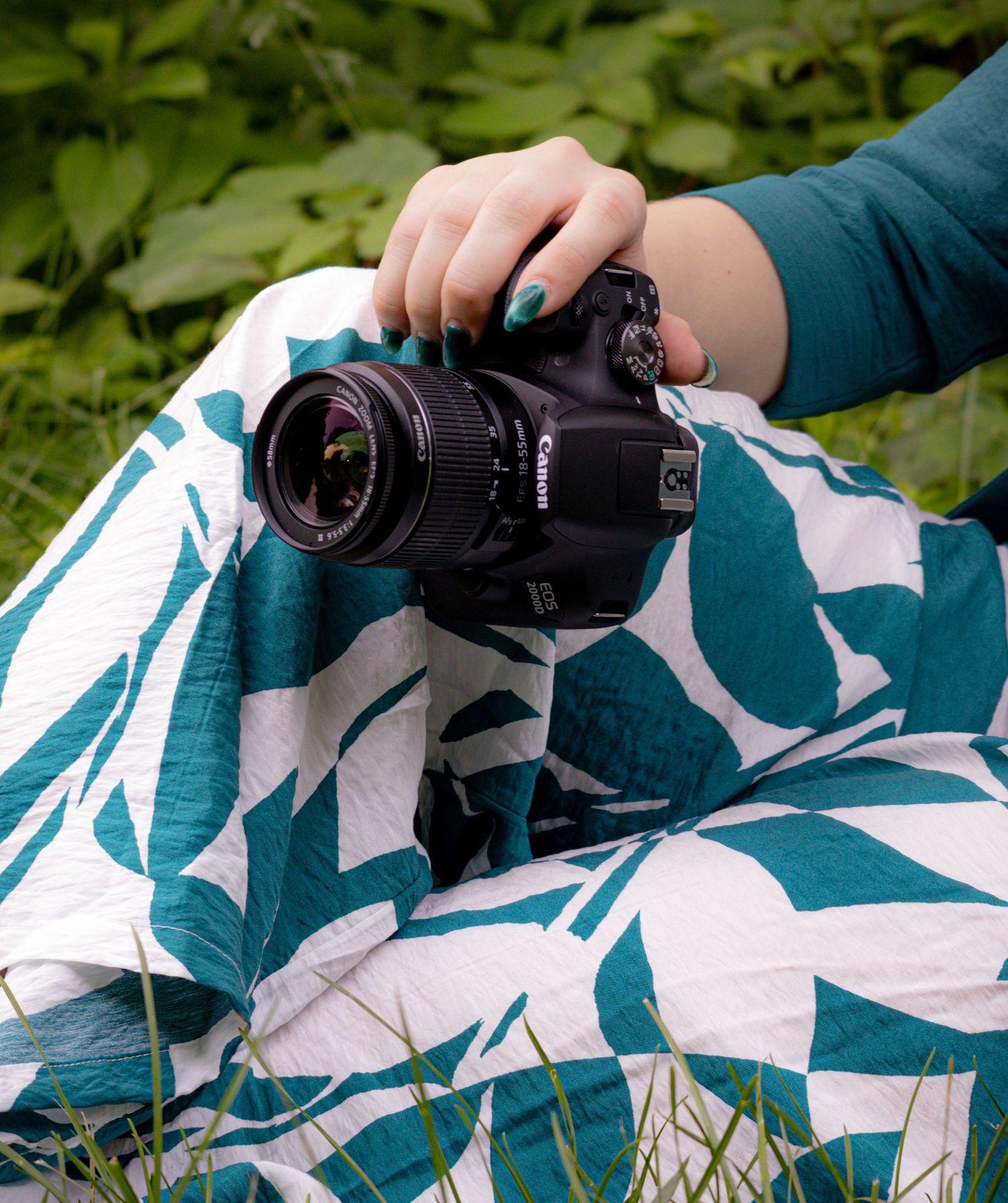 An experienced photographer holding onto a camera