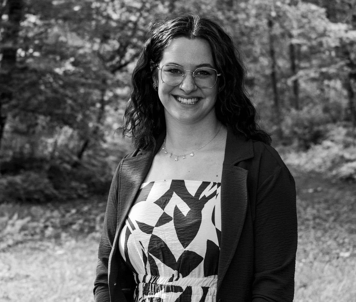 A black and white photo of an experienced photographer, Carley Peterson