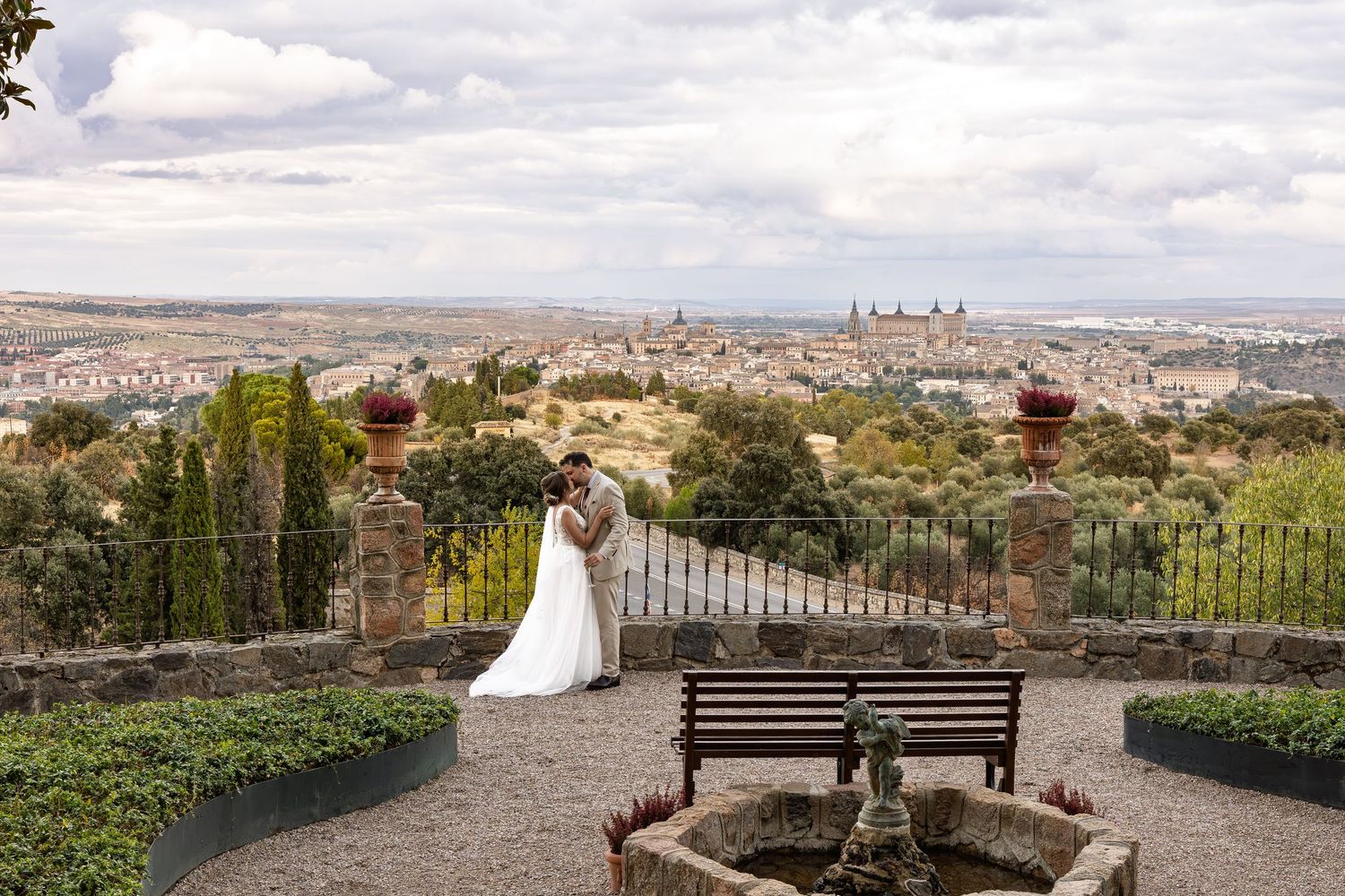 Toledo Spain Wedding, Toledo city in the background, Bride and Groom kissing - by Weddings by JACKsBACK Cambridgeshire & Hertfordshire