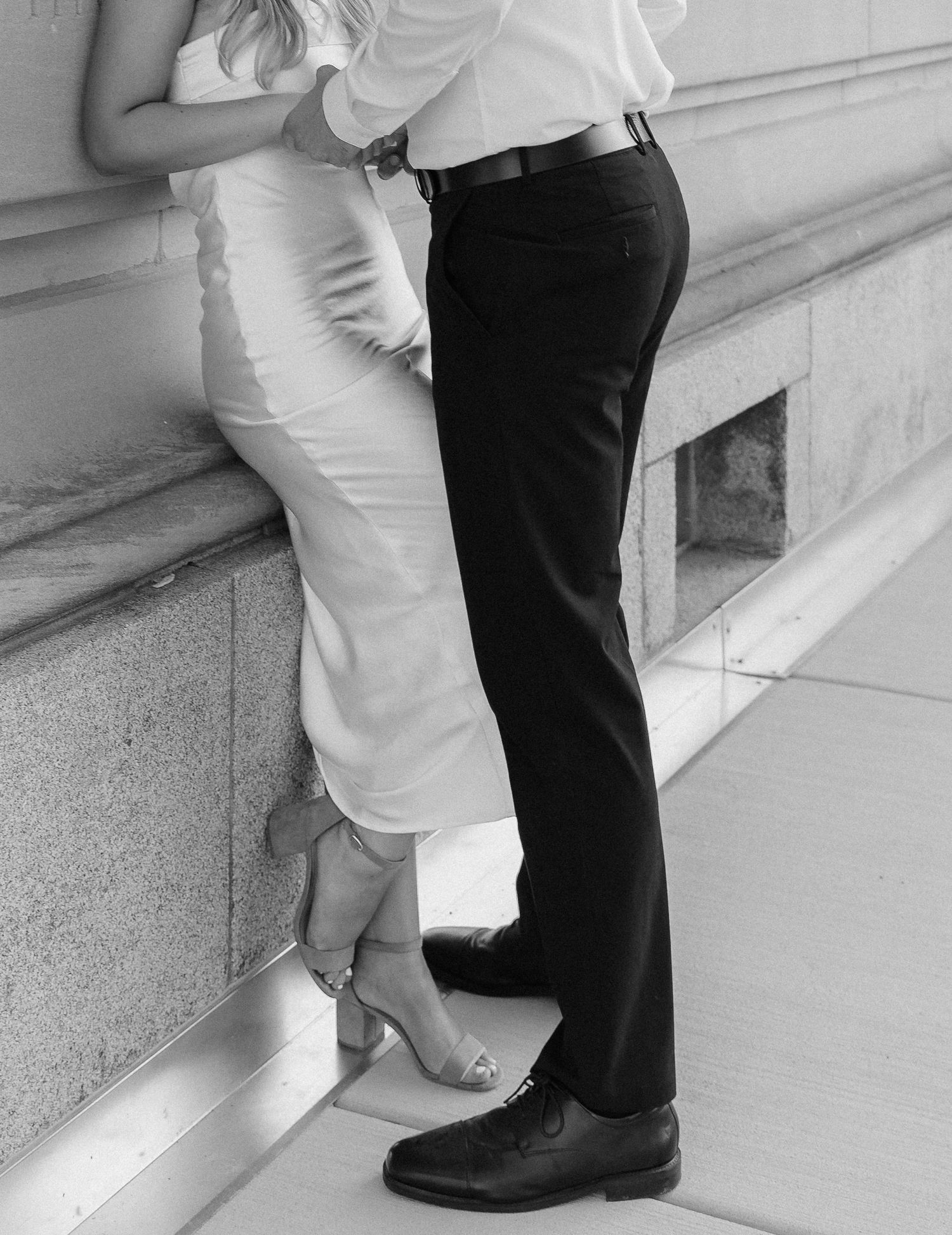 A sequence of black and white photographs showing two people's feet facing each other in an intimate dance pose.