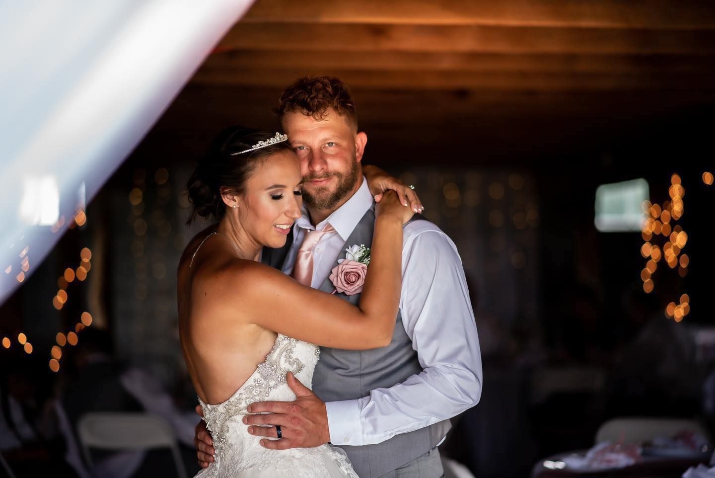 A tender moment between newlyweds during their first dance.