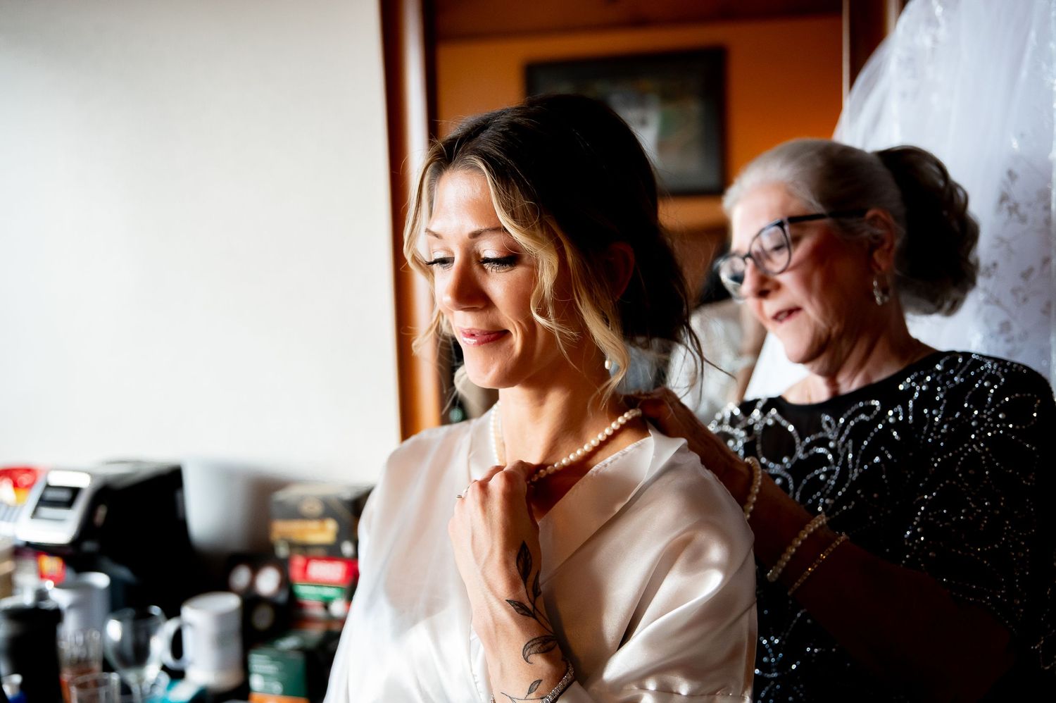 Getting ready moments before the wedding captured in soft natural light.