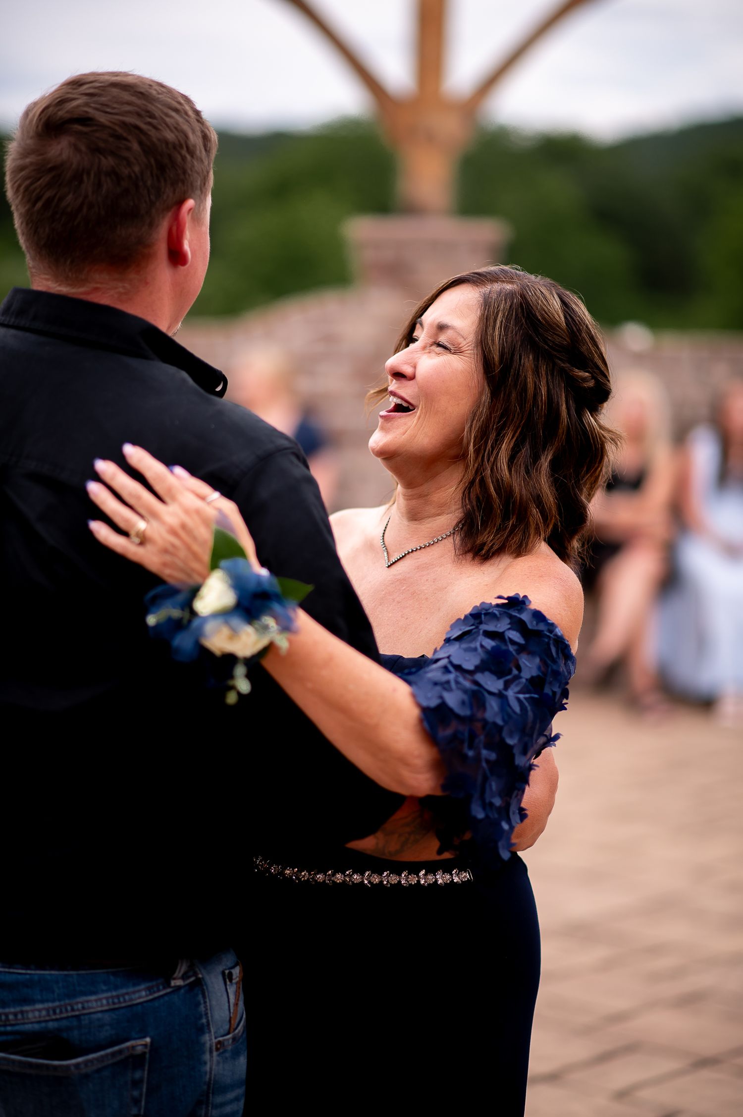 A joyful dance moment at an outdoor celebration.