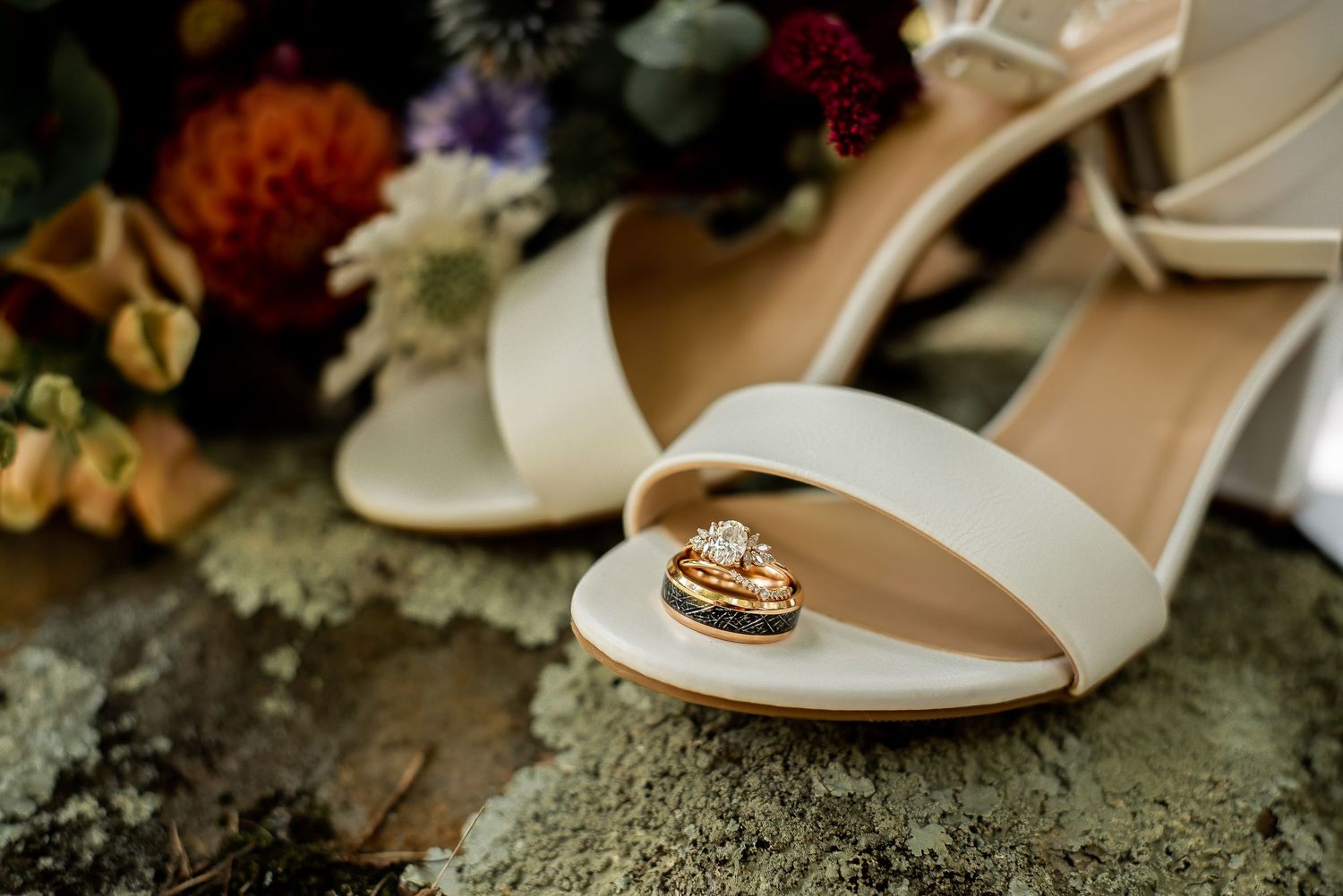 Elegant wedding shoes displayed with autumn-colored florals and vintage styling.