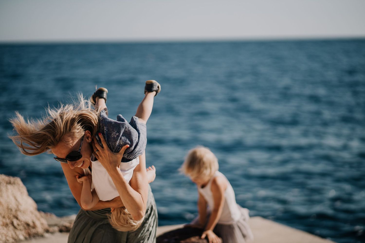 Hvar Engagement photographer Croatia
Parents and children laughing together during a family vacation session by the sea in Split