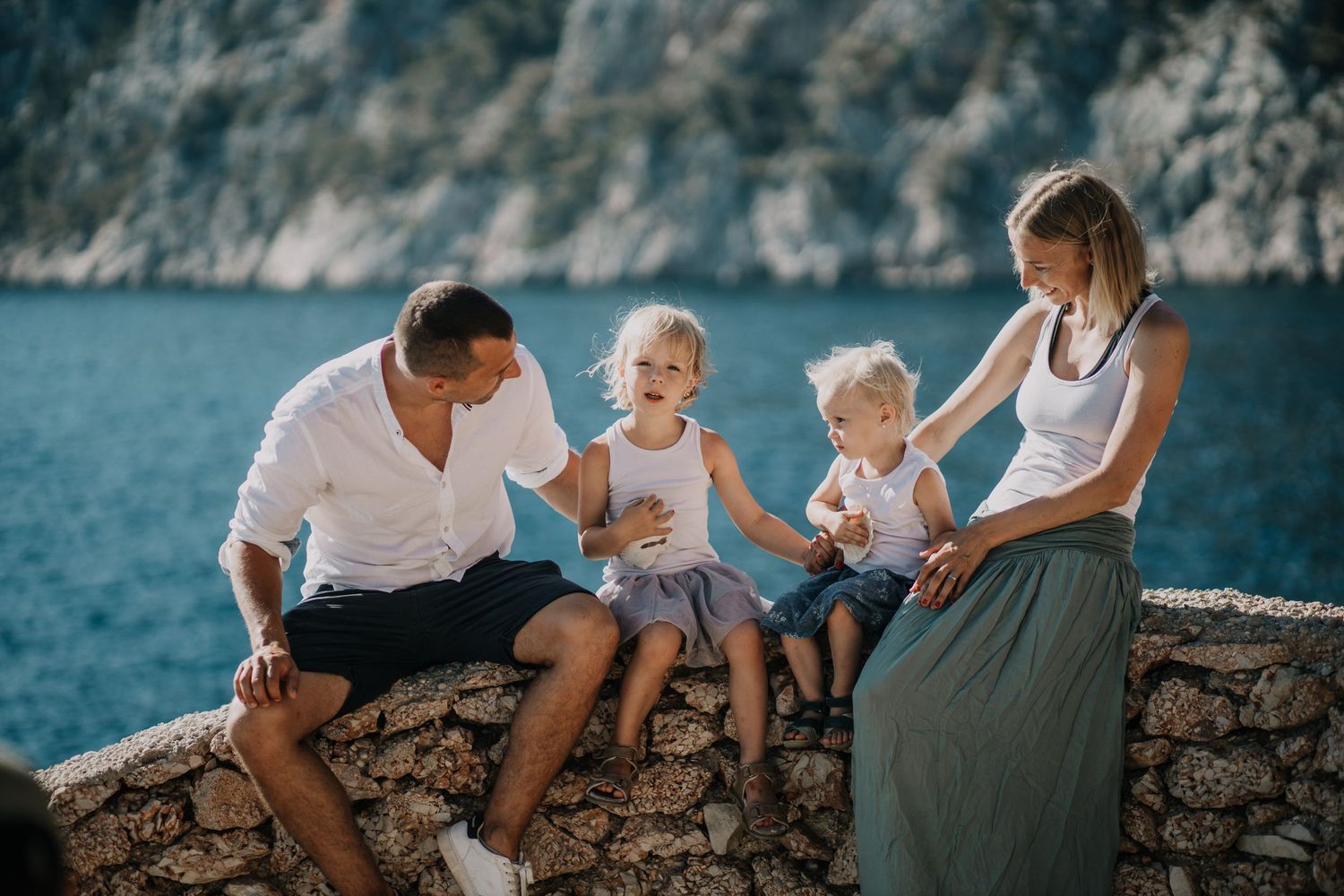Family enjoying a fun and relaxed beach photoshoot in Dubrovnik, Croatia