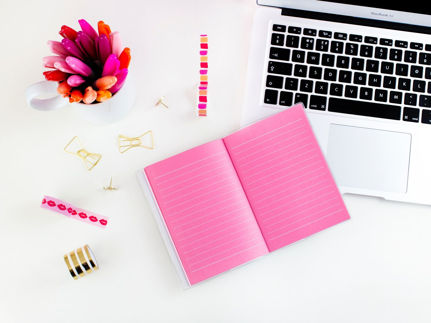Pink-on-pink workspace with Sharpies and ideas waiting to happen
