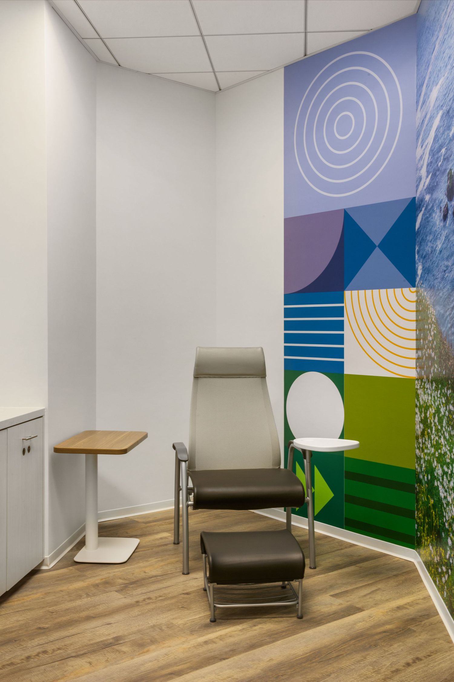 Calm relaxation room featuring blue and green brand-inspired patterns symbolizing growth and renewal.