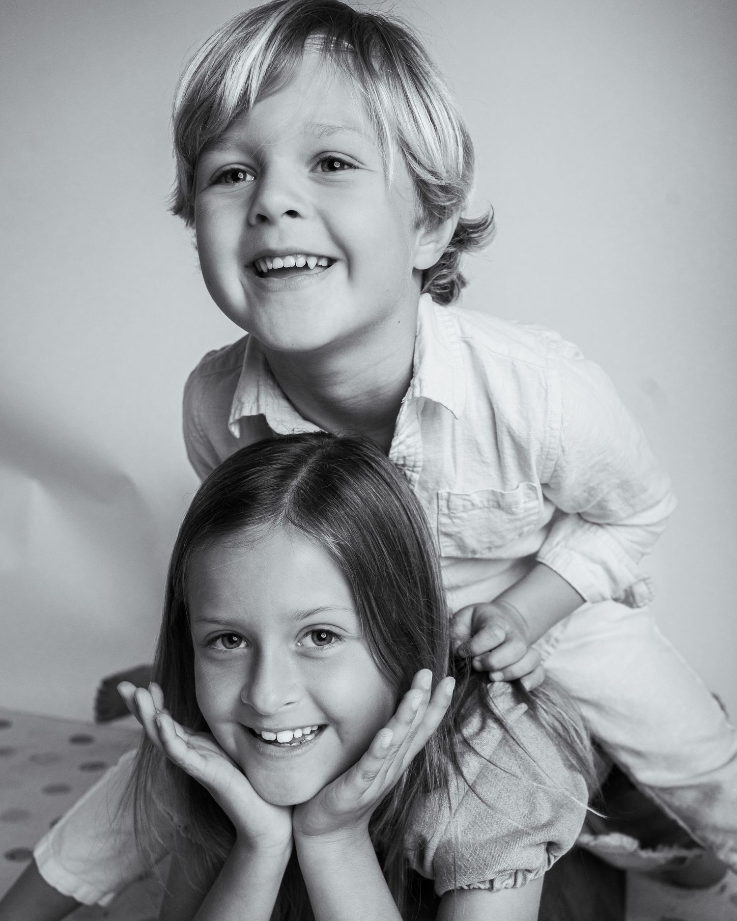 high energy Black and white portrait of siblings