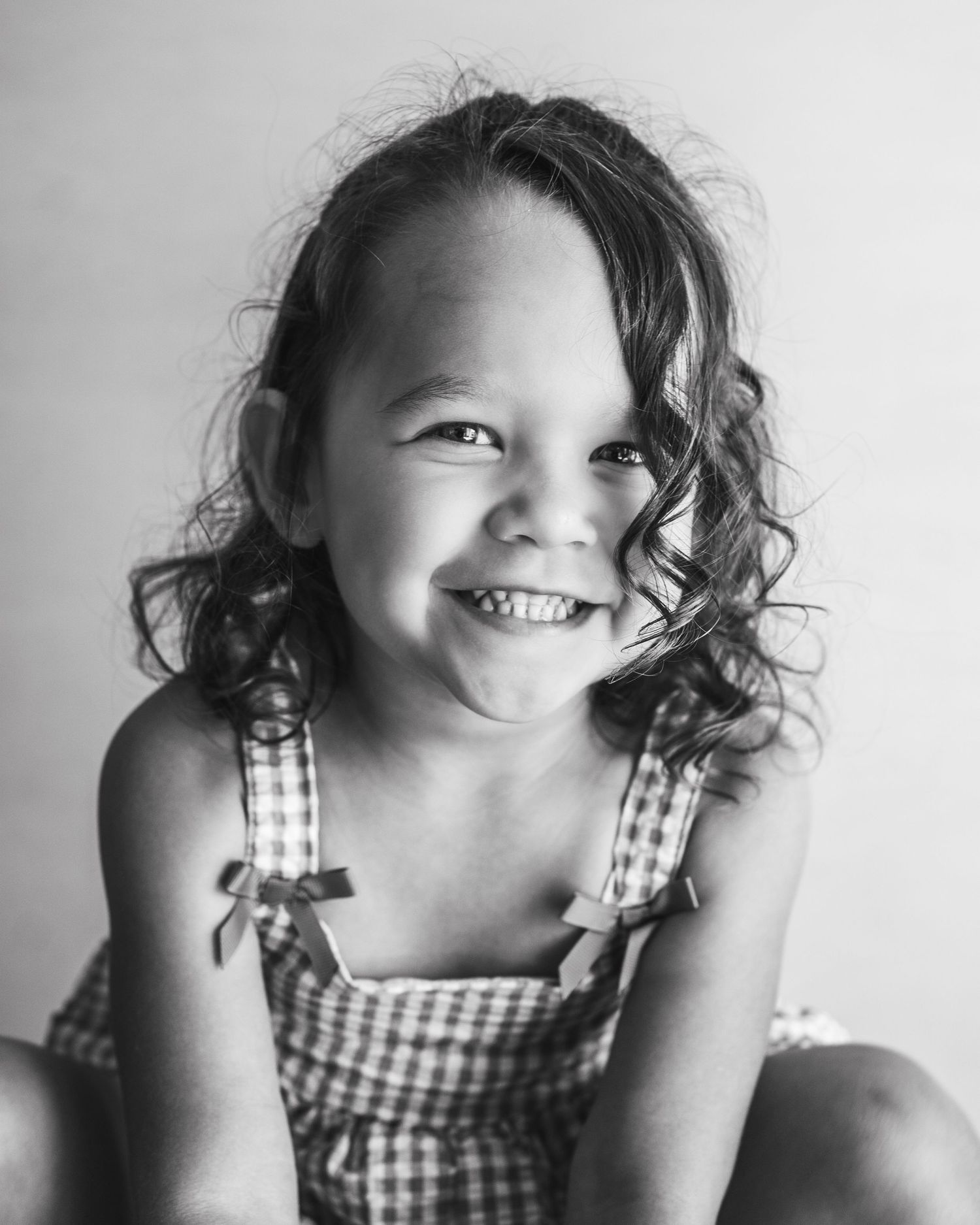 One-of-a-kind personality, captured in black and white. A joyful portrait session for a girl who shines from the inside out.