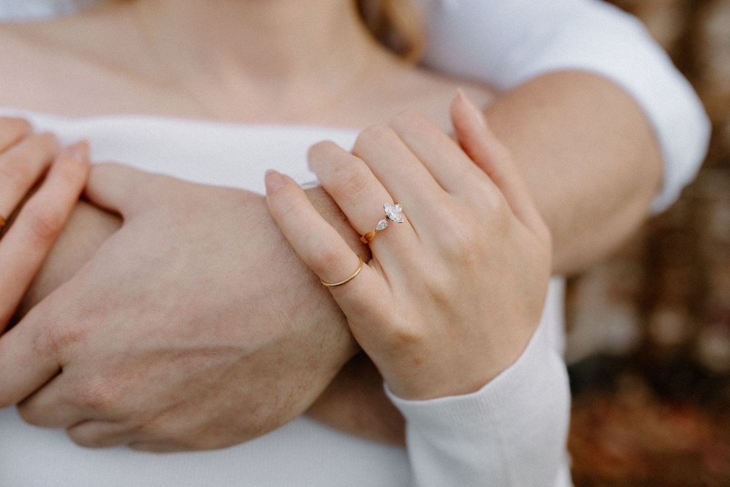 Detail shots of embraced arms and hand with an engagement during Wisconsin engagement session