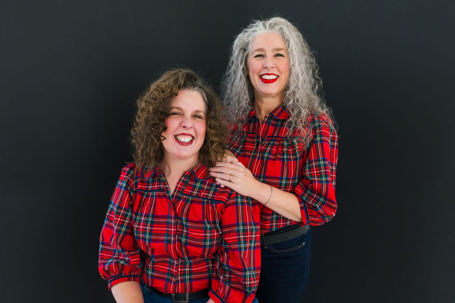 Studio portraits showing laughter and joy against dark background.