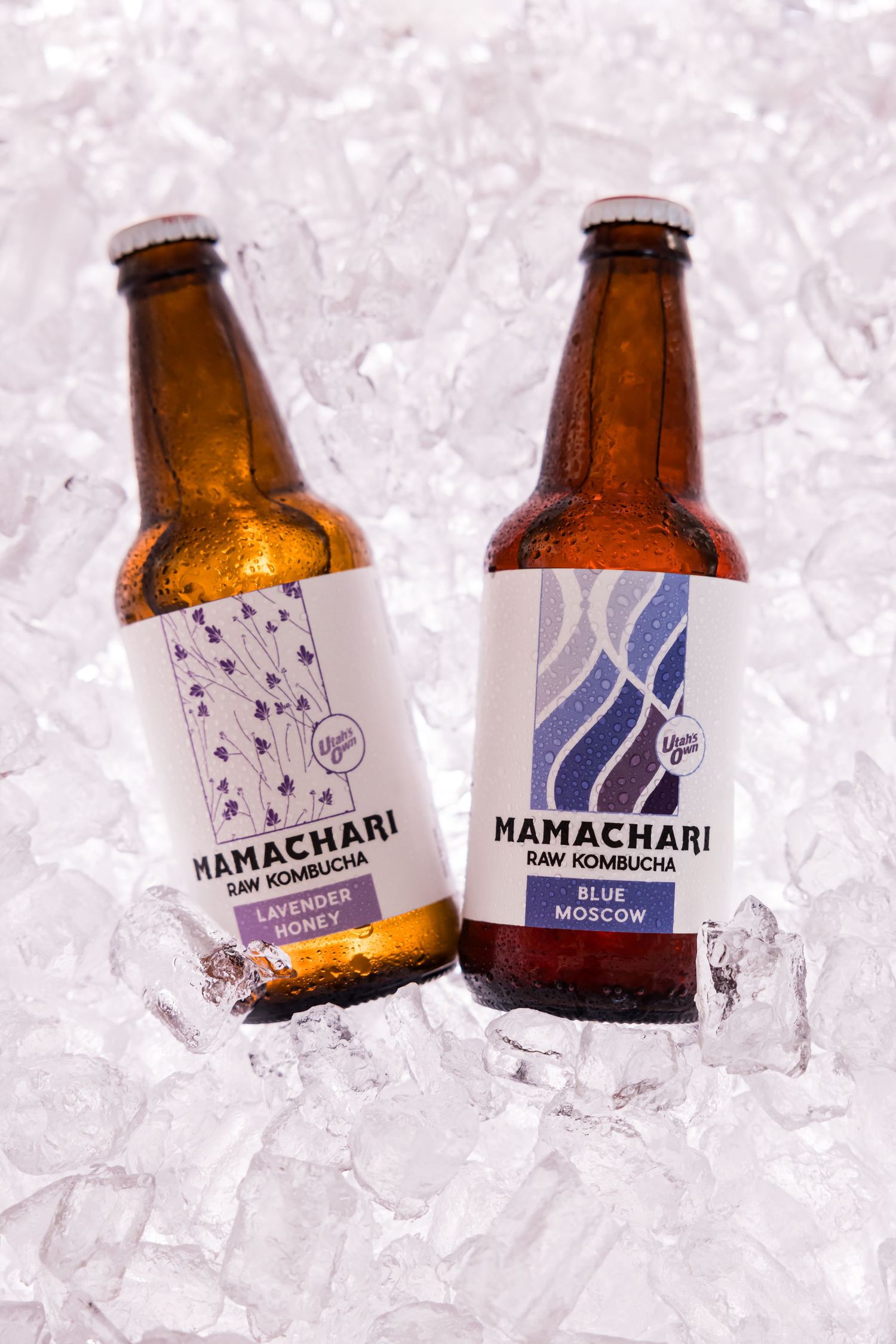 Two bottles of Mamachari craft beer with minimalist labels chilling in a bed of ice.
