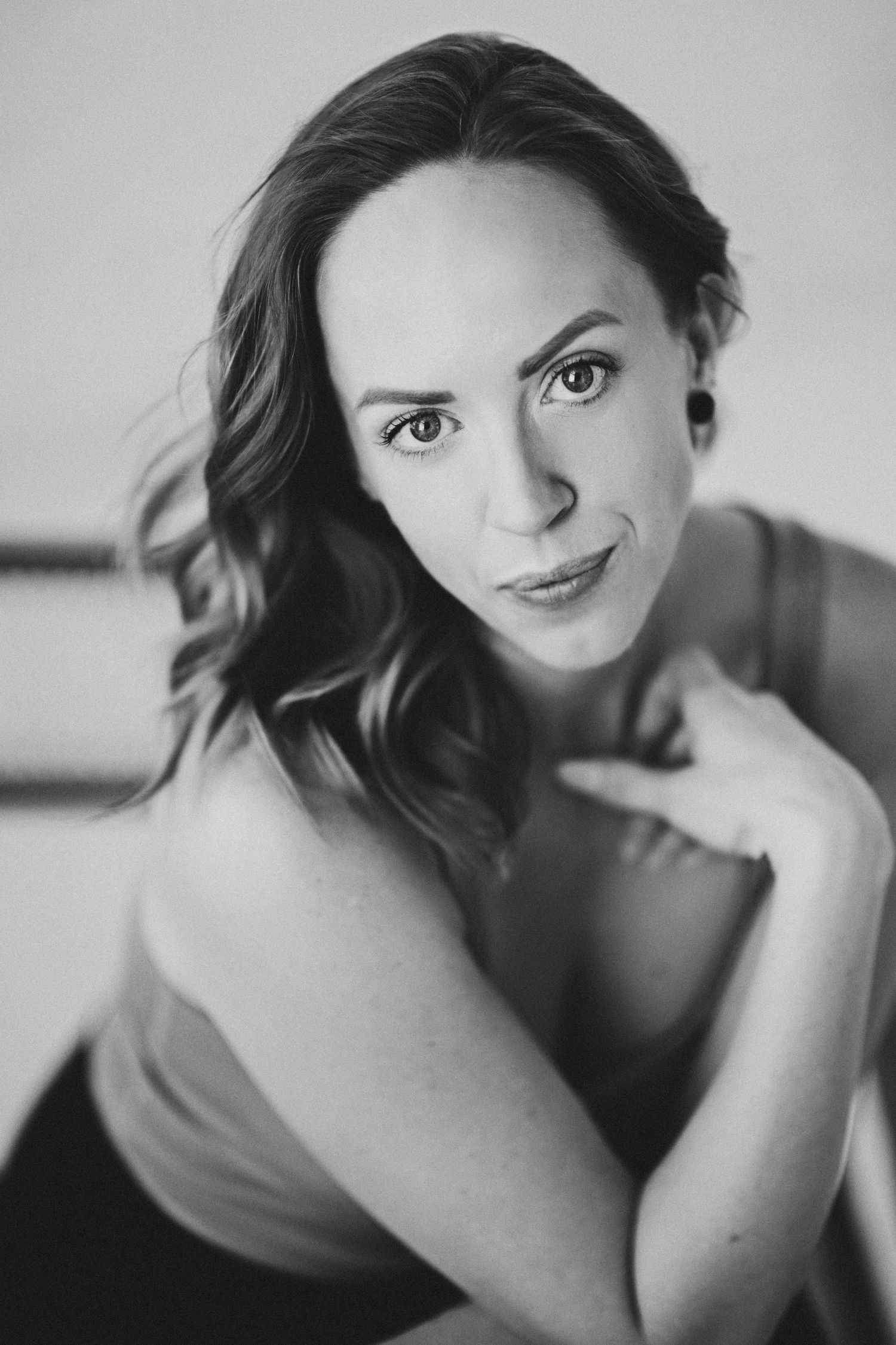 Artistic black and white portrait series with dramatic lighting and natural expressions.