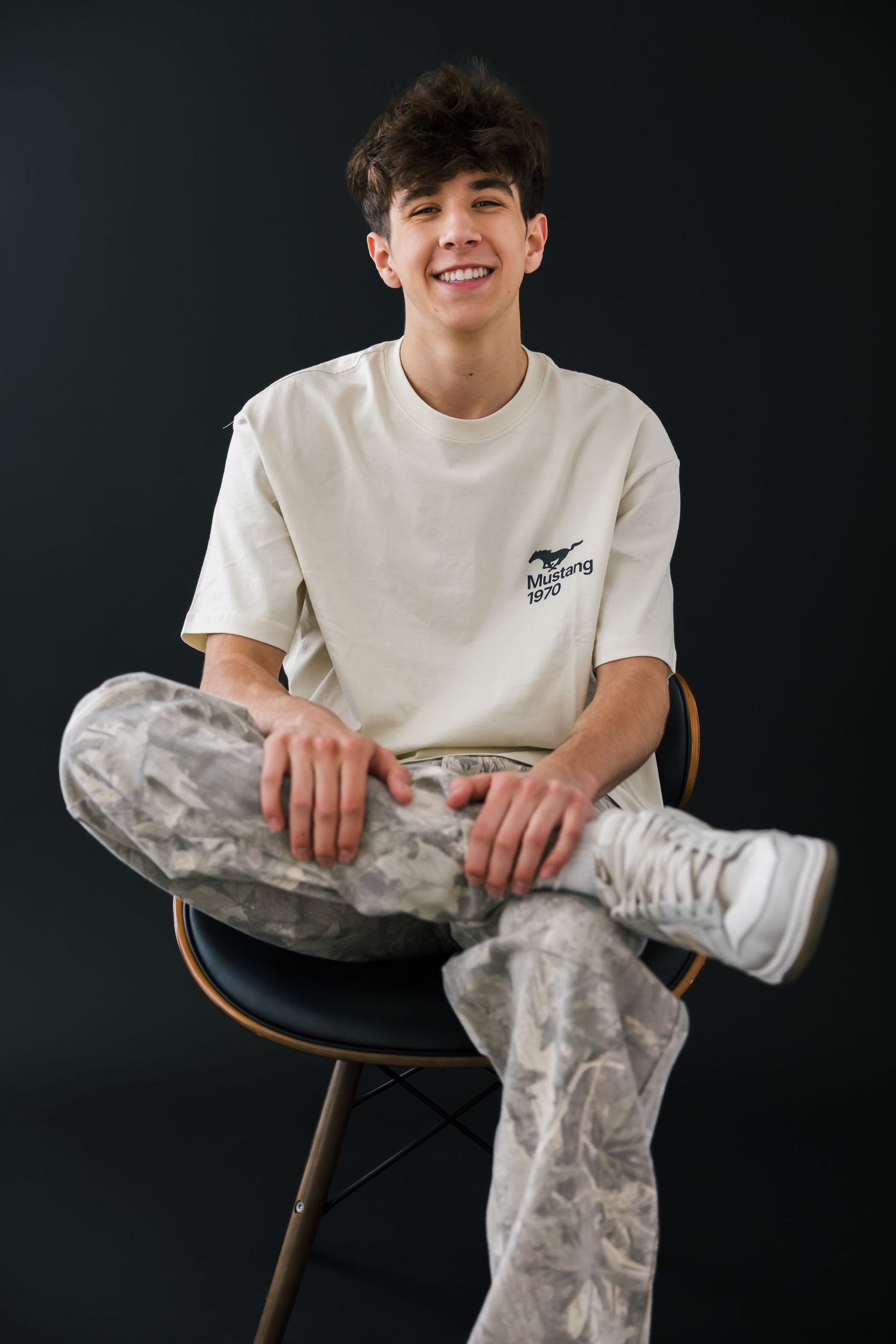 True-to-color studio portrait of senior guy in minimalist setting