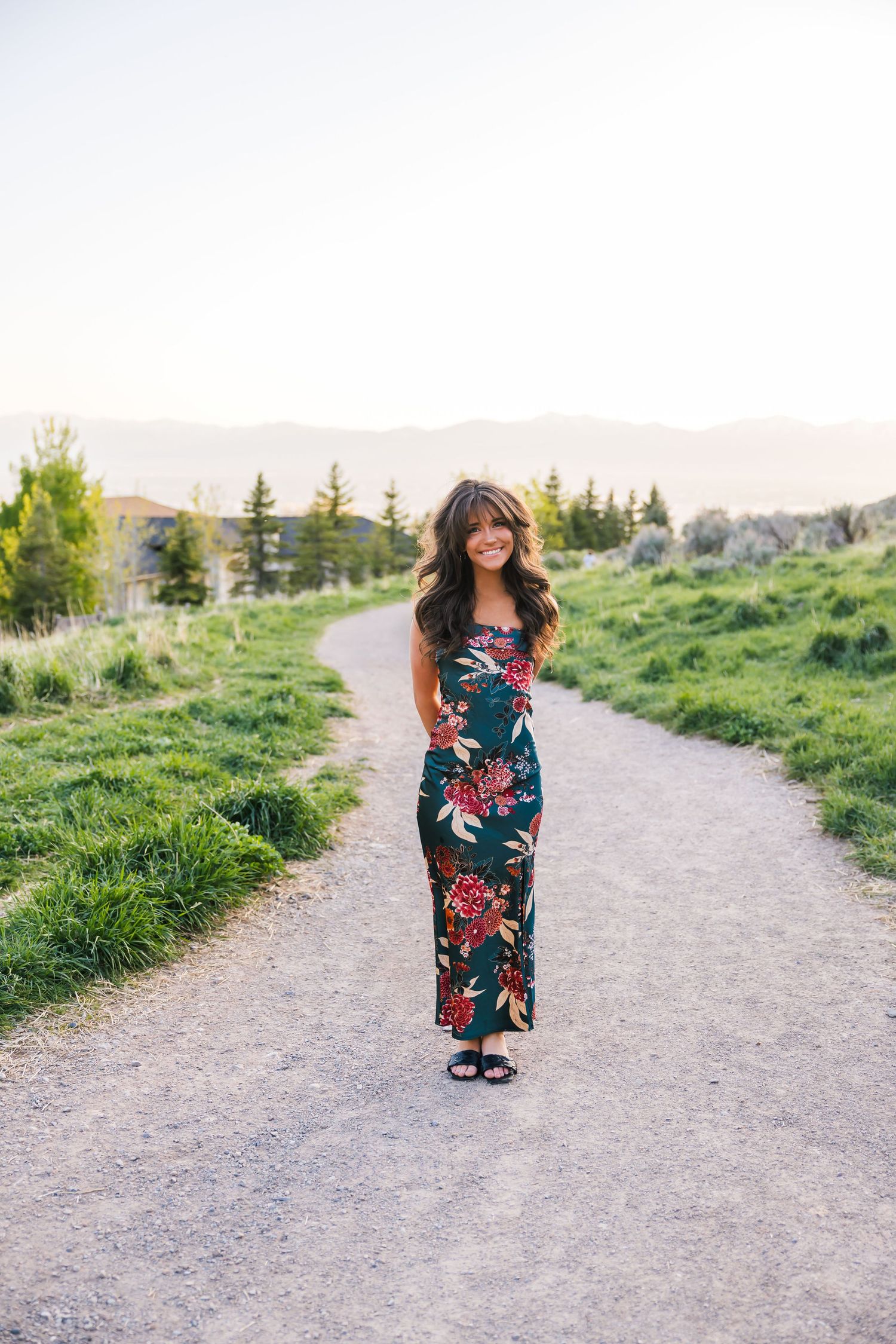 True-to-color outdoor senior session with Utah senior girl. Relaxed senior girl portrait in grassy field with natural light
