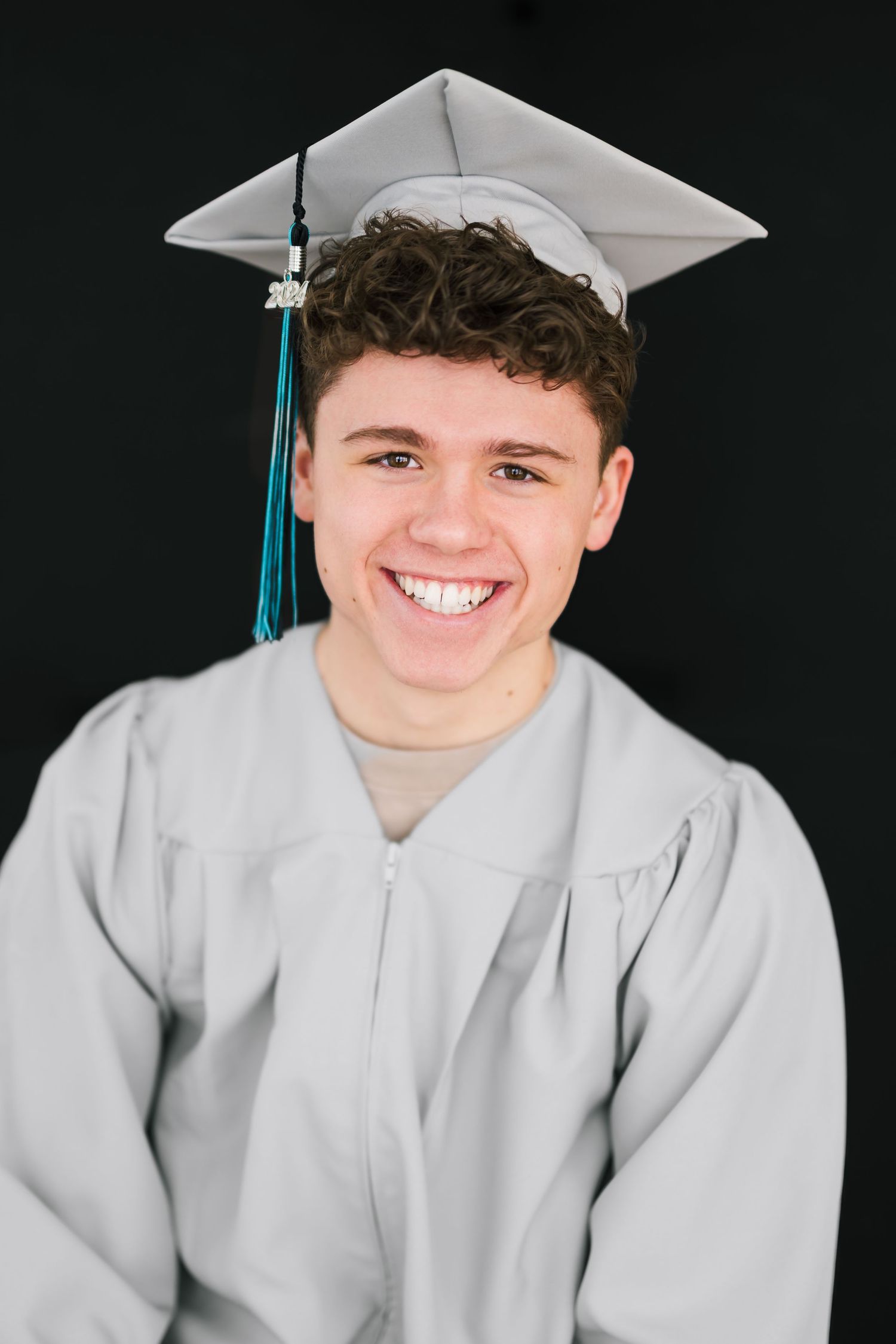 Senior boy smiling during relaxed studio photo shoot in Salt Lake City