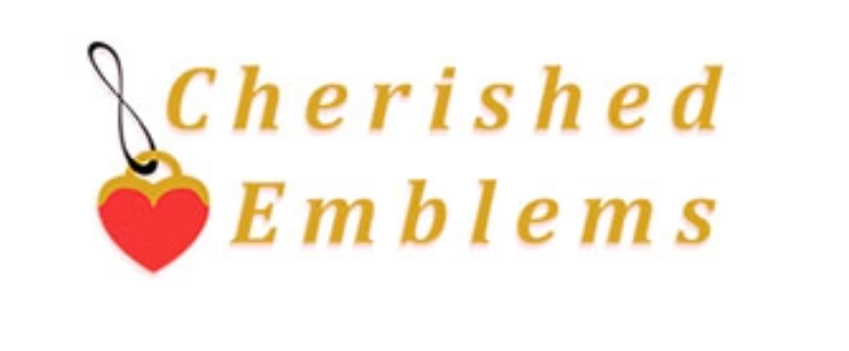 A collection of colorful enamel pins and pins of Cherished Emblems brand merchandise displayed on white paper.