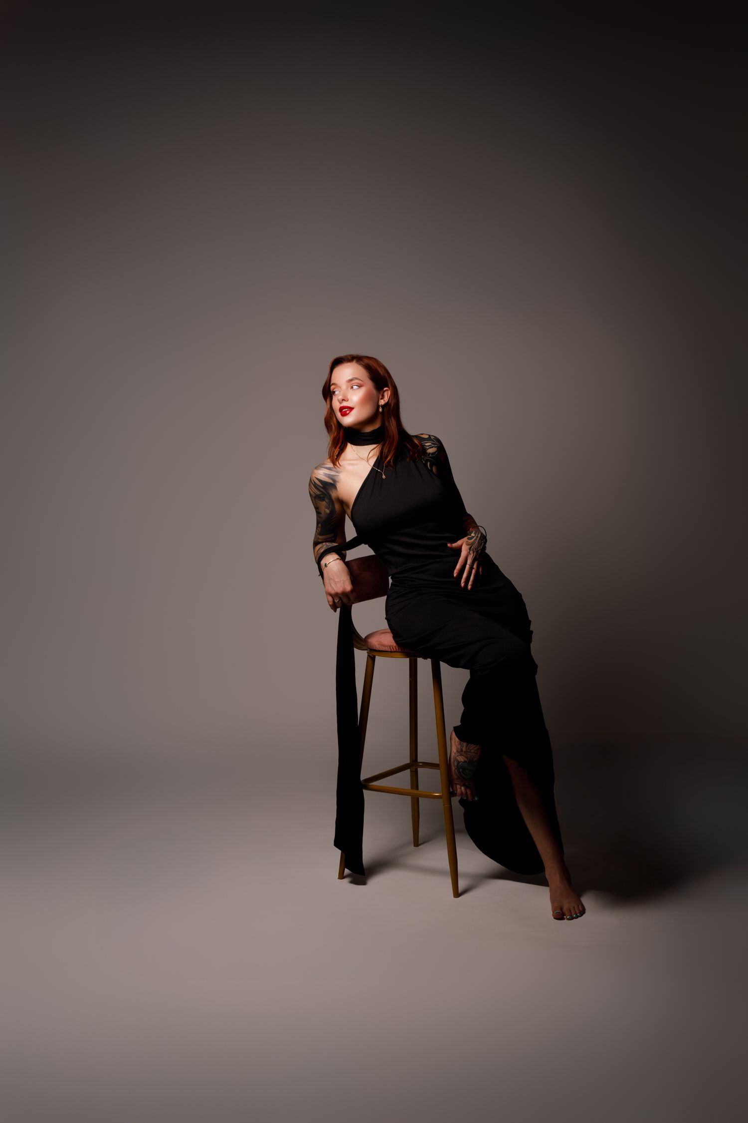 Artistic full-length portrait series showing poses with a wooden chair in studio lighting.