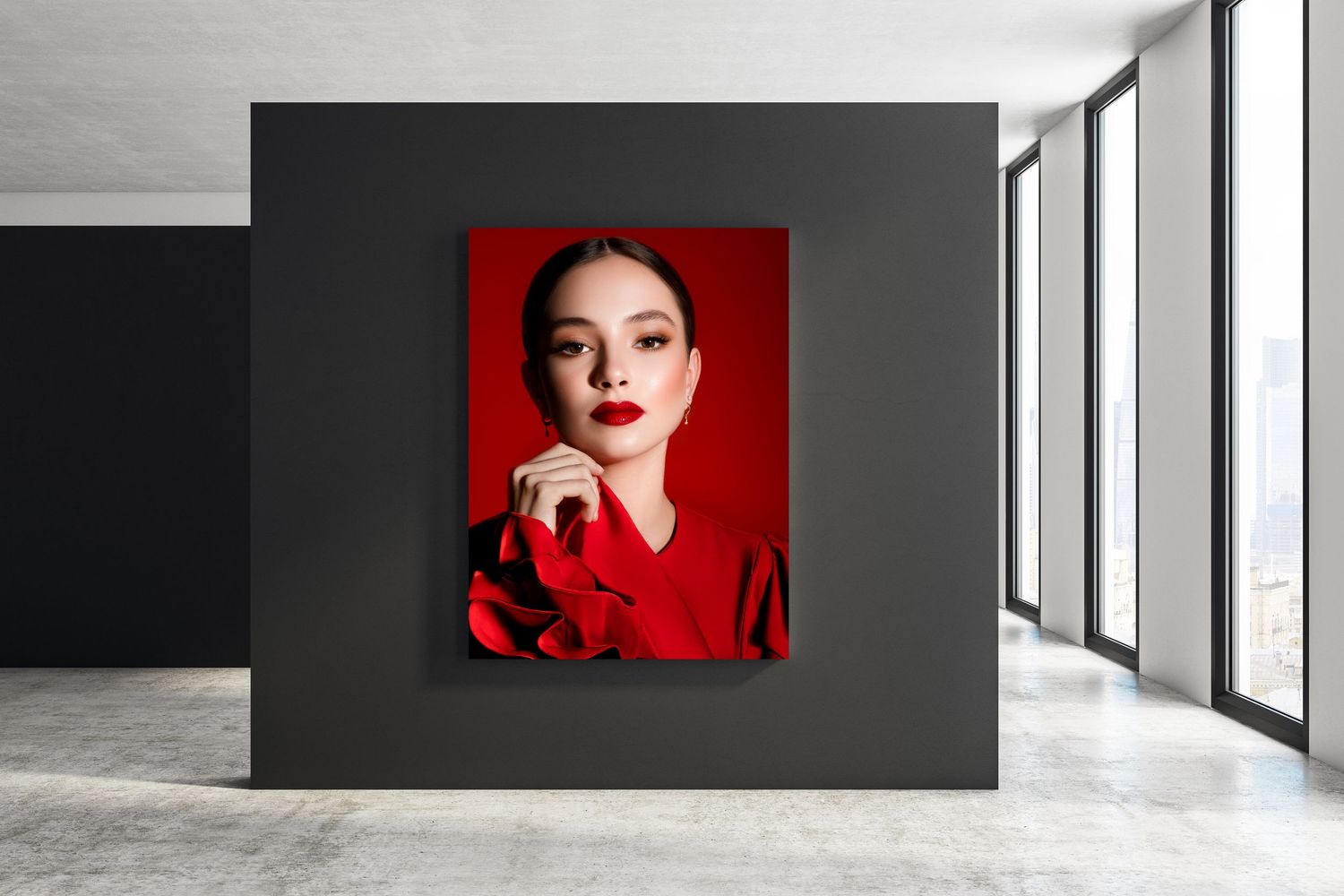 A striking portrait of a woman in red displayed as large wall art in a modern gallery space.