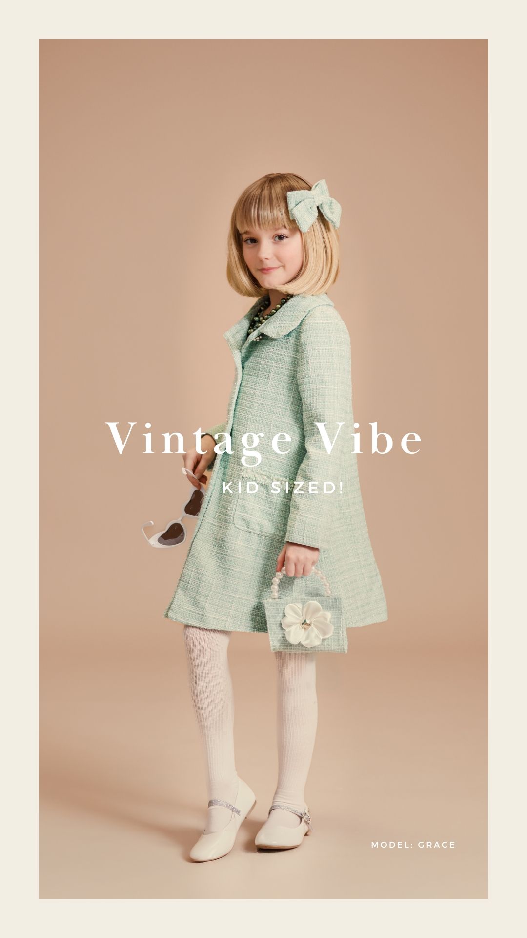 Young girl in mint green vintage tweed coat with bow hair accessory, white tights, and floral handbag for kids fashion.