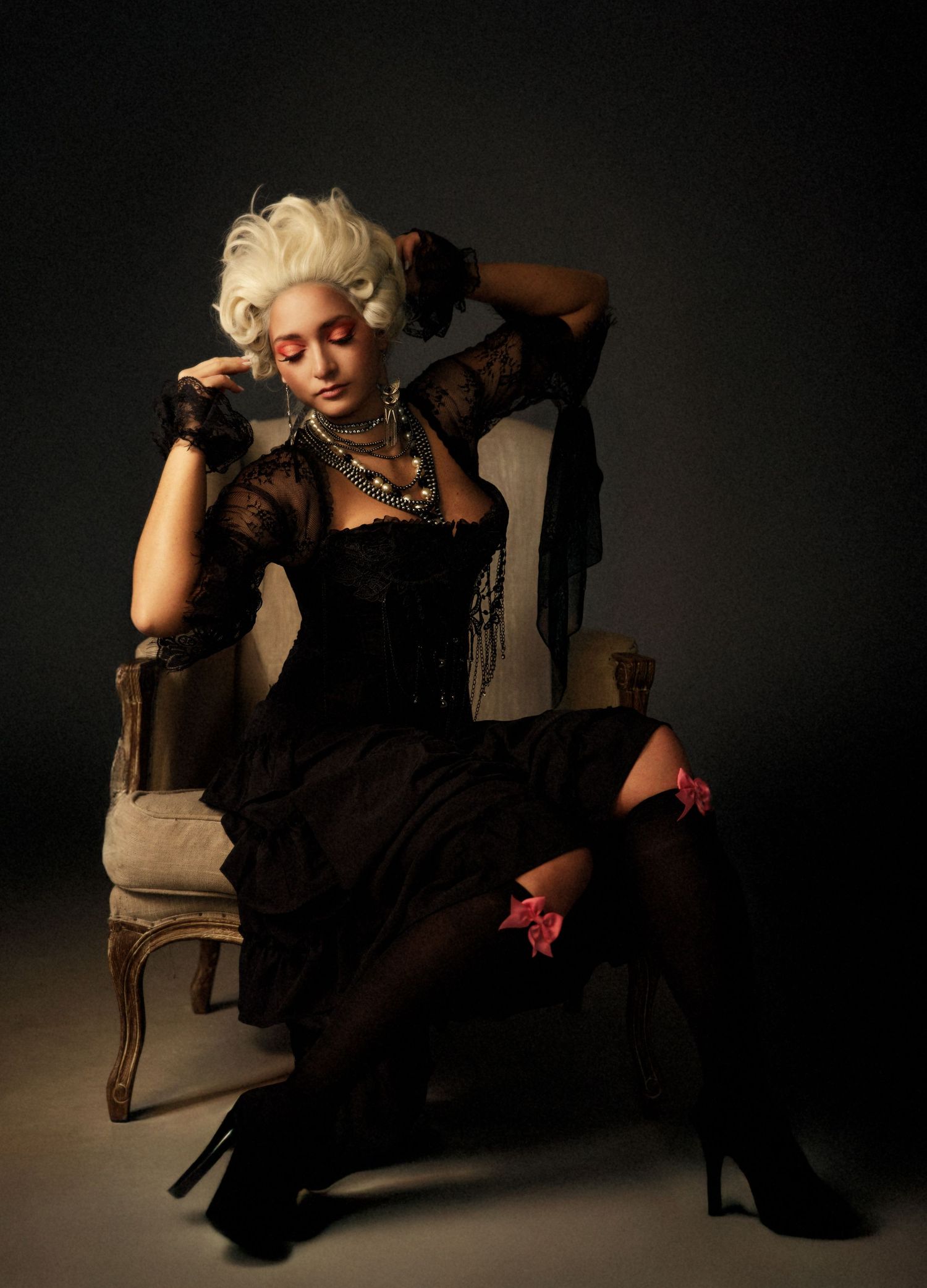 Dramatic black and white fashion series featuring vintage-style clothing and dramatic poses on the floor.