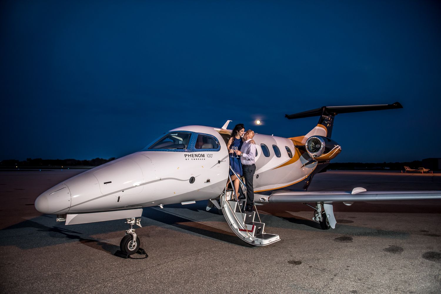 Luxury engagement photoshoot with a couple aboard a private jet at Waterloo Airport near Toronto.