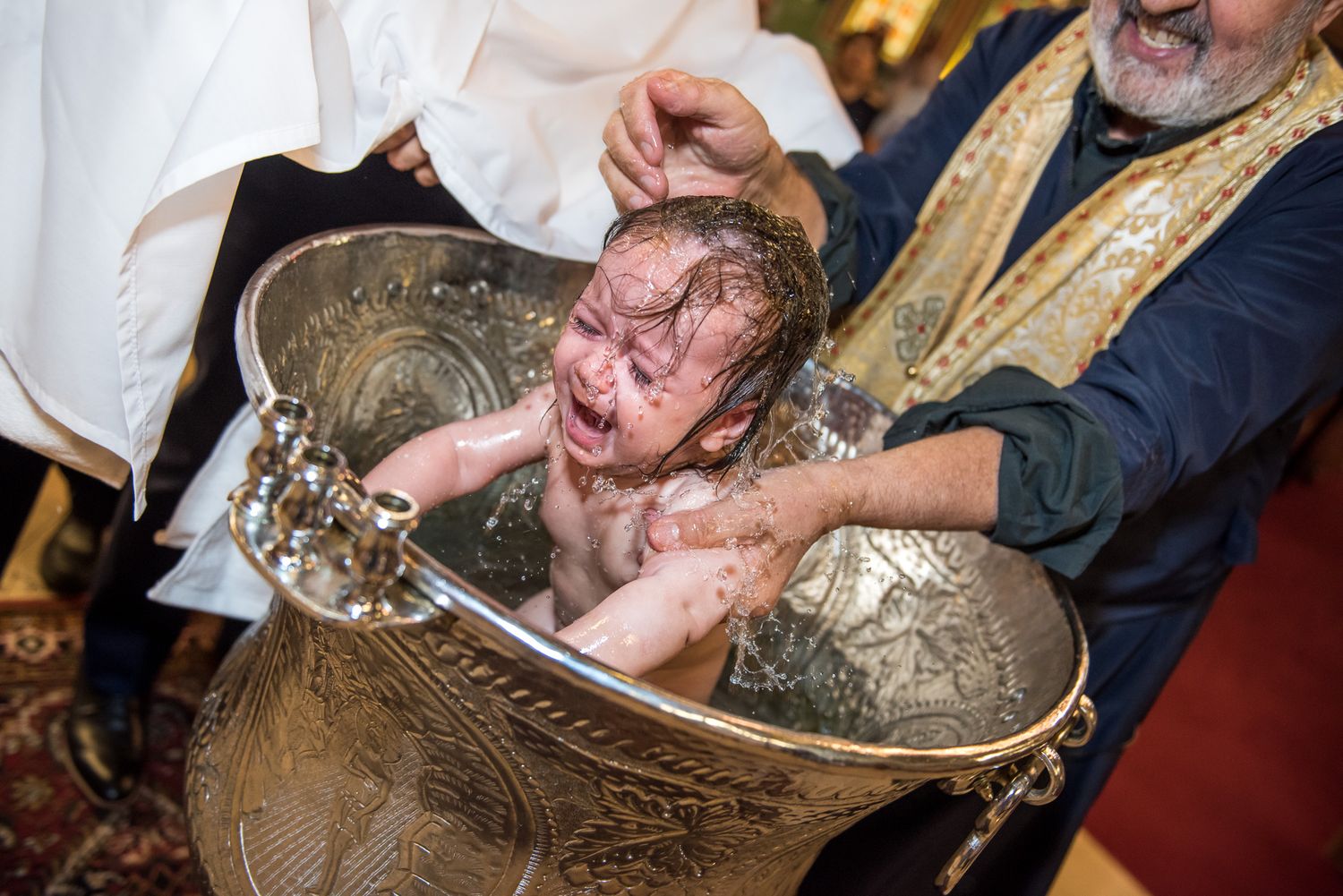 Greek Orthodox baptism photography documenting a sacred family celebration.