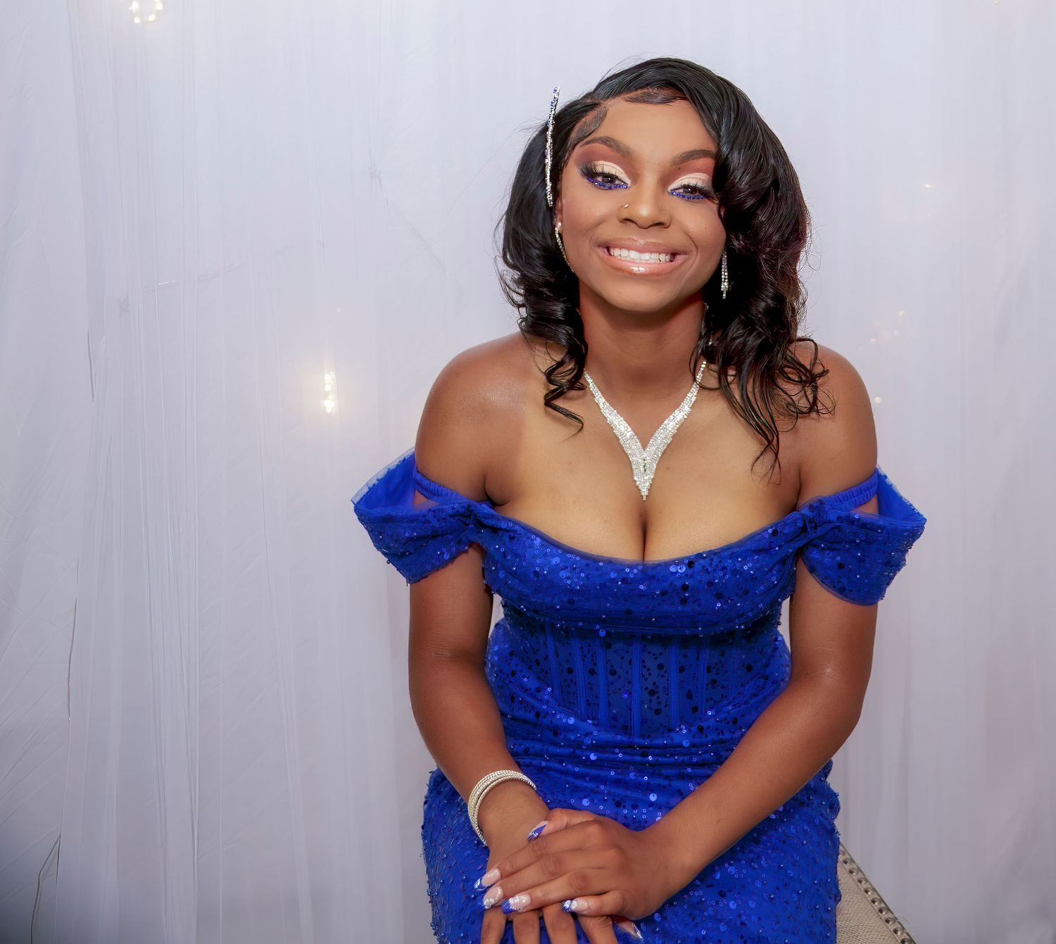 Indoor studio of young lady smiling about the joy of going to  prom R&T photography in Oklahoma