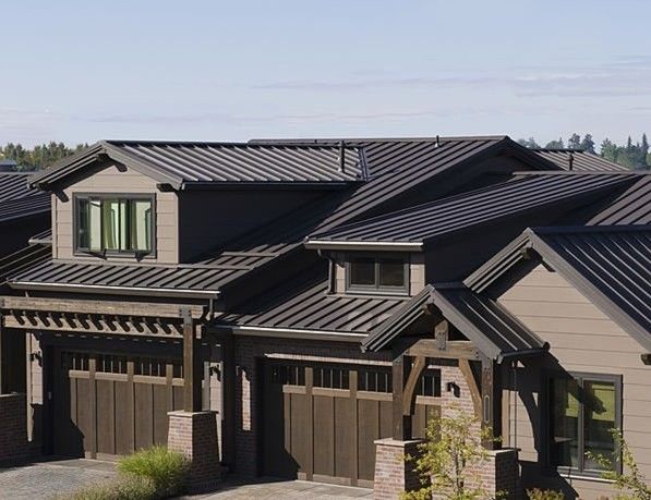 Modern dark metal roofing installed on residential homes with clean lines and contemporary architectural design.