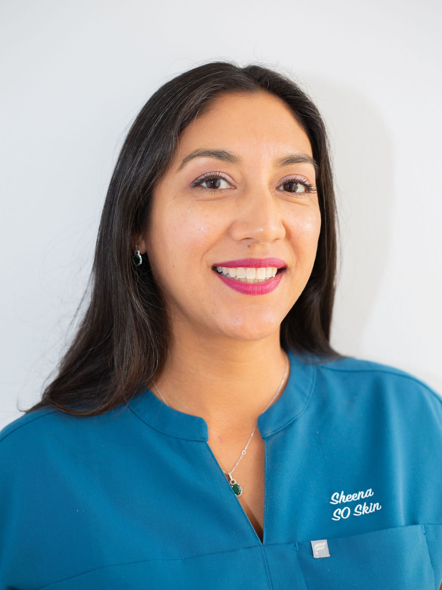 Professional headshot of a woman in blue uniform smiling | Nuvue Visuals portrait photography in San Diego
