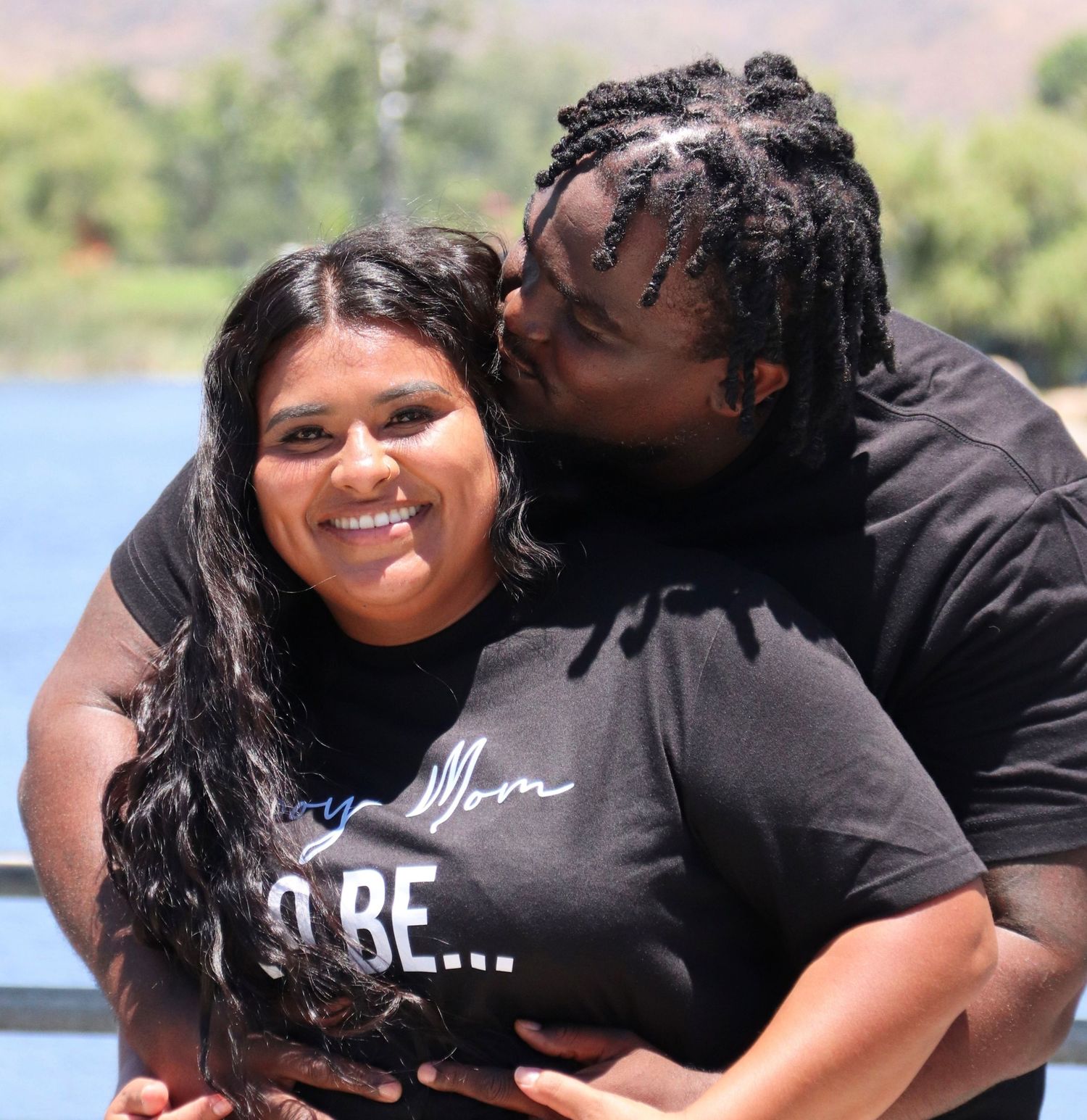 Couple sharing a romantic moment outdoors near Santee lake | Nuvue Visuals couples and engagement photography in San Diego