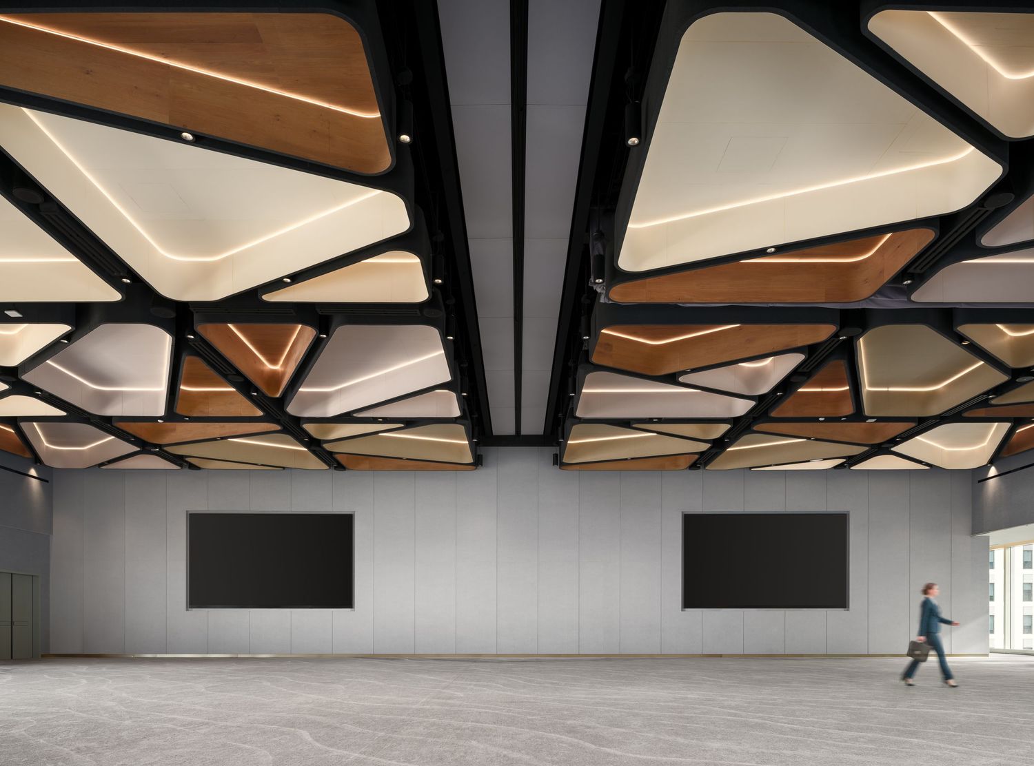 Commercial interior photo showing Acoufelt acoustic ceiling panels inside a modern event space at the Radd District, captured by Luca Prodi.