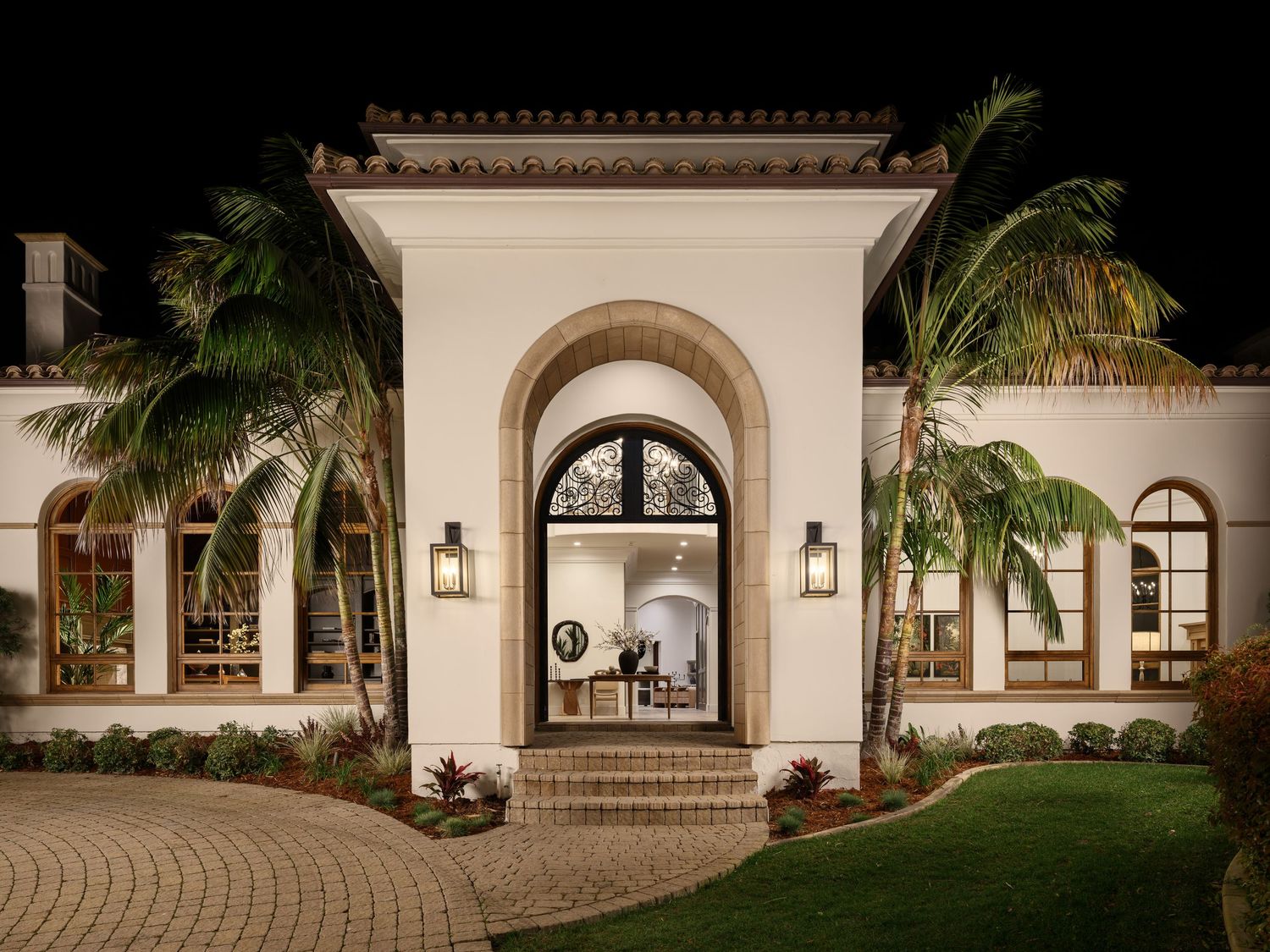Exterior architectural photo of Rancho Santa Fe luxury flip, captured at dusk for a builder, highlighting Mediterranean design.