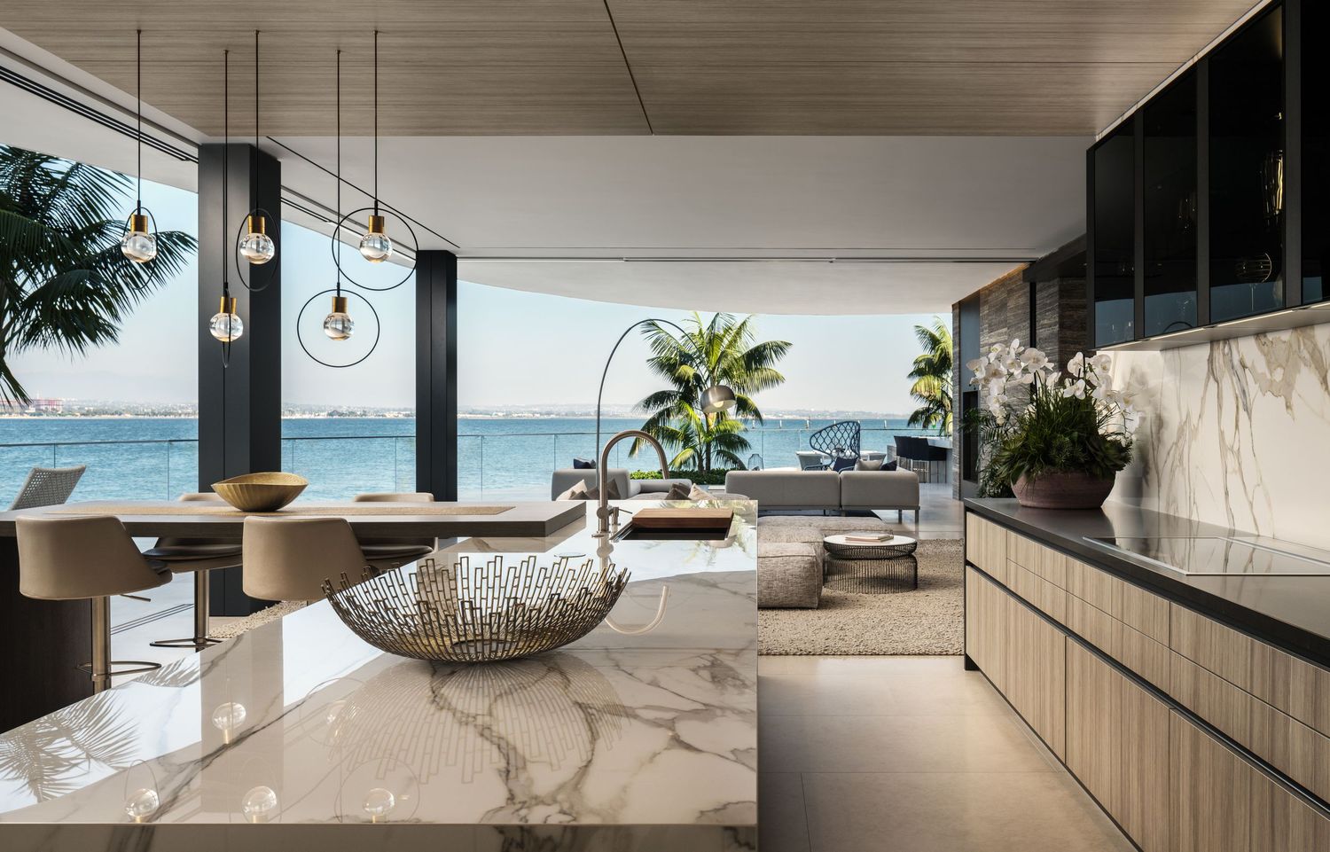 Coronado 3 The Point luxury waterfront kitchen and dining opening to bay views—interior photography by Luca Prodi