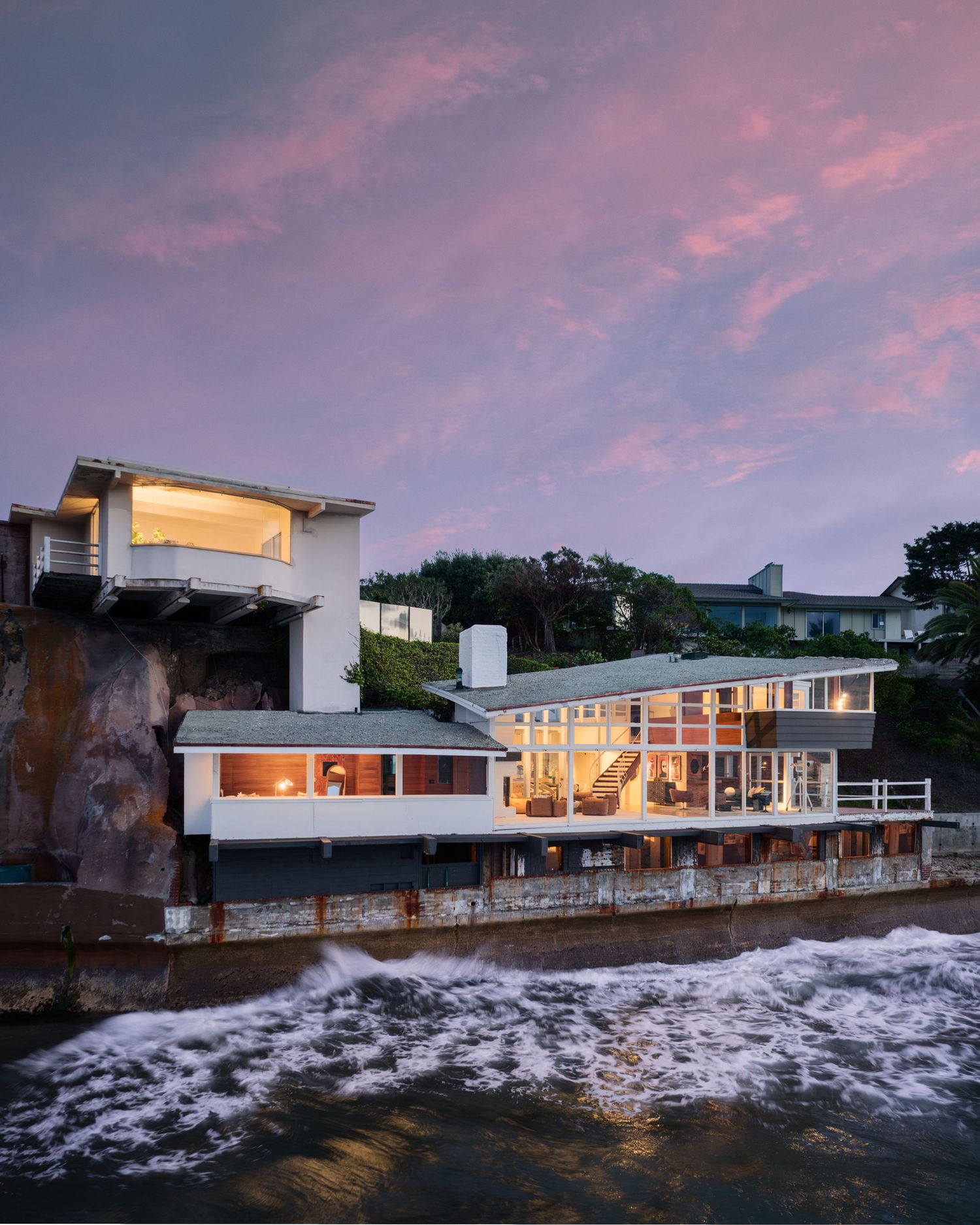 Iconic oceanfront exterior of 1890 Spindrift Drive by architect William Kesling, dramatically set above the Pacific with midcentury stylings