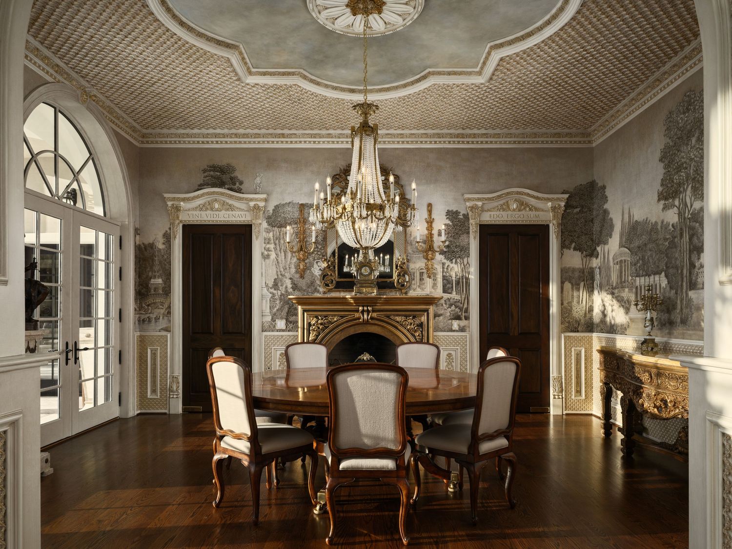 Formal dining room in the Fielding House featuring mural walls, ornate molding, arched French doors, and a crystal chandelier.