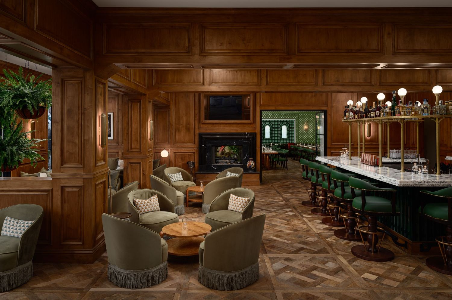 Classic bar interior at Bing’s Bar at The Inn at Rancho Santa Fe with rich wood paneling, marble bar, and intimate lounge seating.