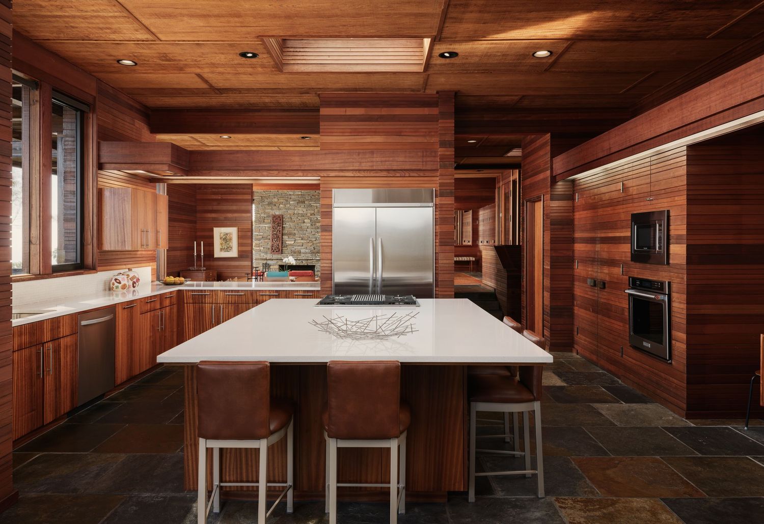 Midcentury kitchen at 7226 Romero with wood ceilings and stone floors, real estate photography san diego showing luxury coastal design.
