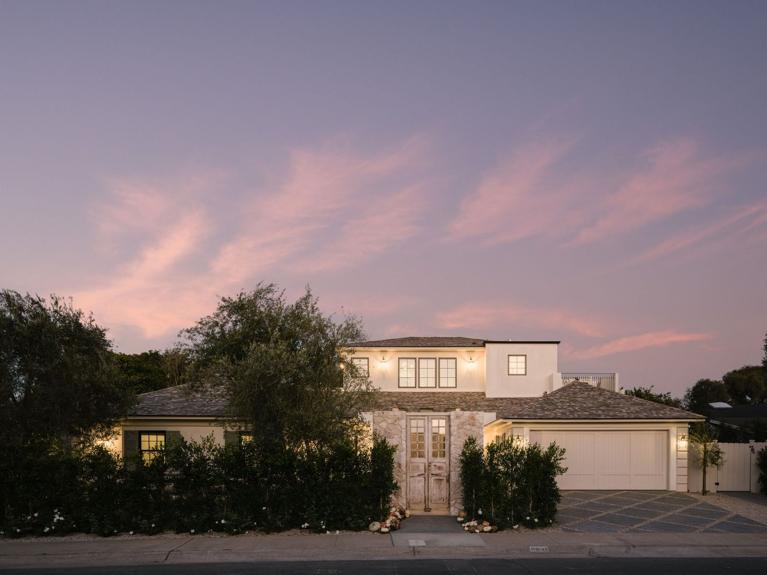 La Jolla luxury real estate twilight exterior with modern architectural design refined details and high end lighting in soft evening light