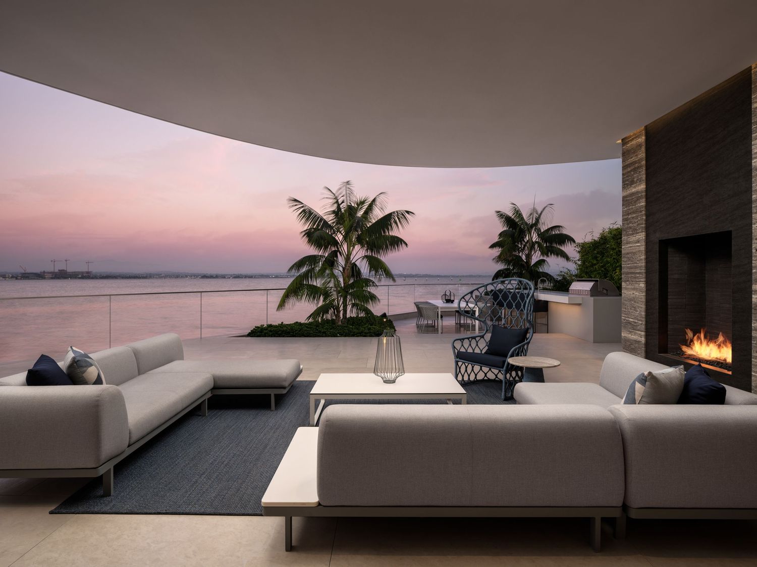 Coronado 3 The Point waterfront terrace at sunset with outdoor lounge and bay vista—luxury residence photography