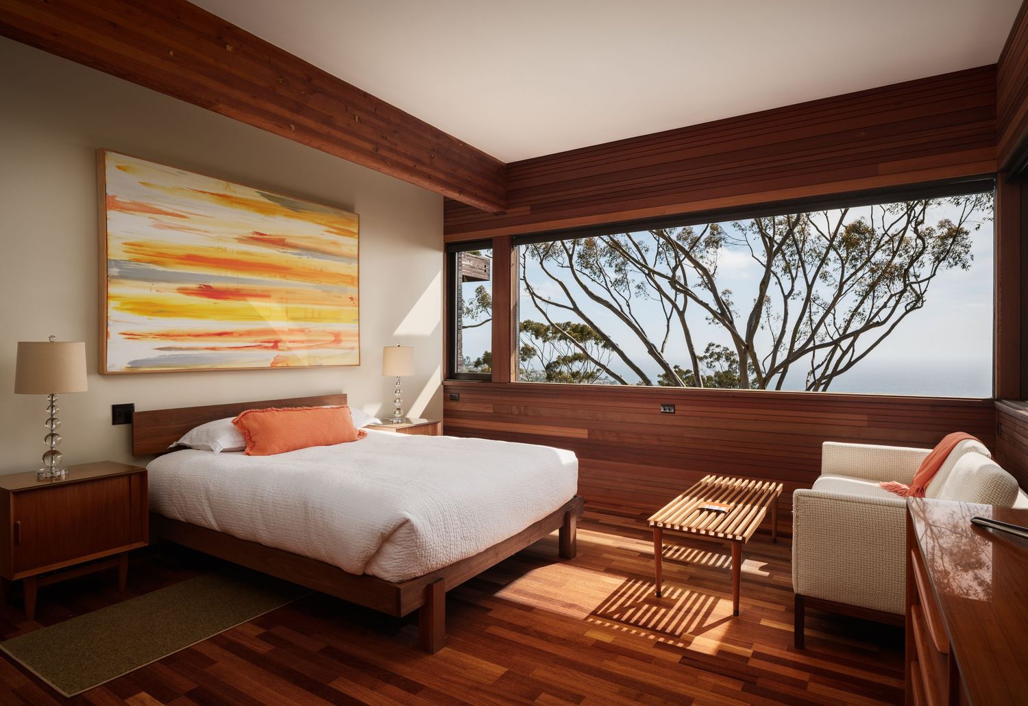 Midcentury bedroom at 7226 Romero with large picture window and ocean views, interior design photography san diego showcasing warm wood tone